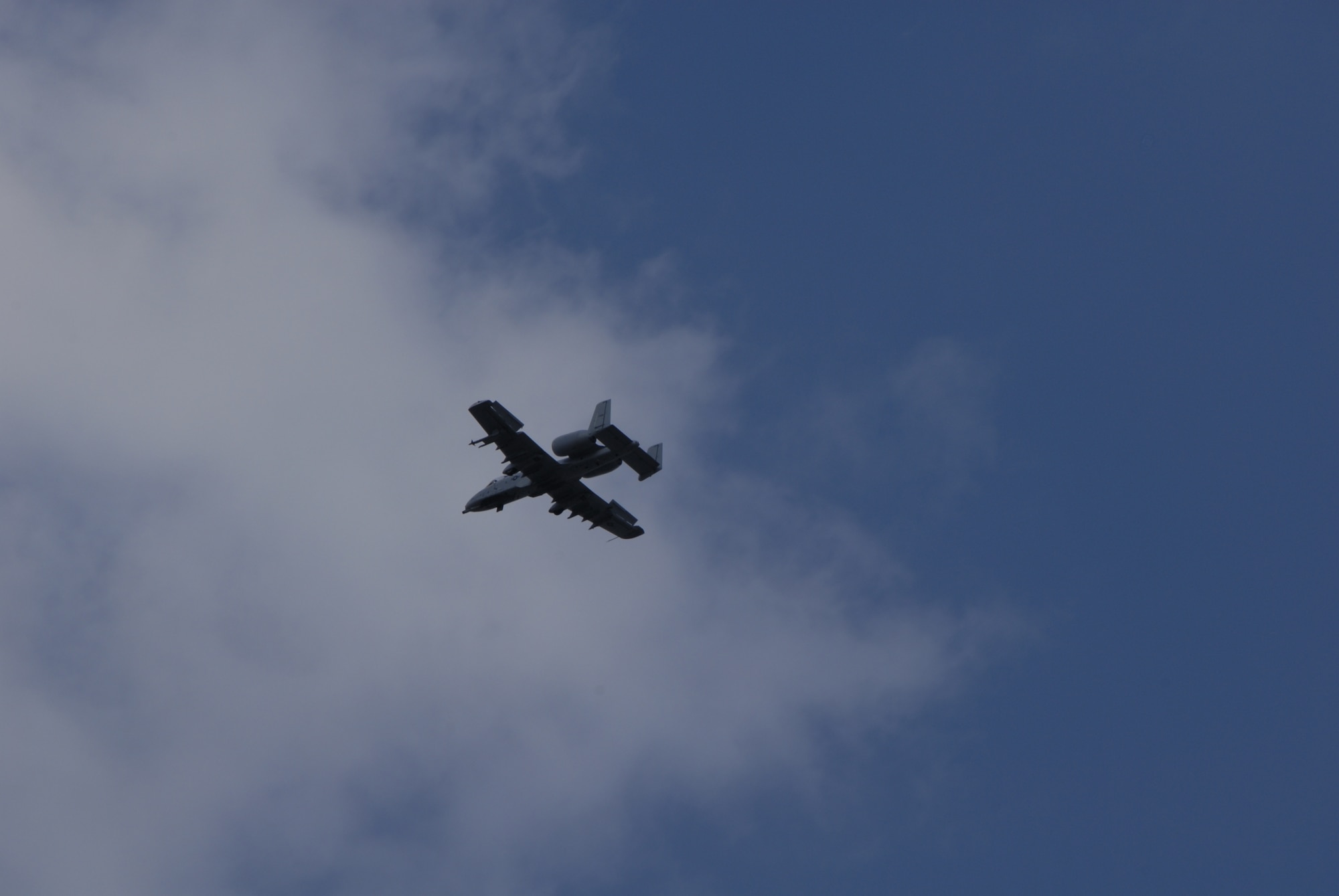 An A-10 Thunderbolt II makes a low-level pass over the airfield at Selfridge Air National Guard Base in Michigan. The 127th Wing, based at Selfridge, recently began flying the aircraft, also known as the Warthog, after completing a transition from flying F-16s. The A-10s are scheduled to be on display and part of the flying demonstration during the 2009 Selfridge Air Show, Aug. 22 and 23. (U.S. Air Force photo by Technical Sgt. David Kujawa) 