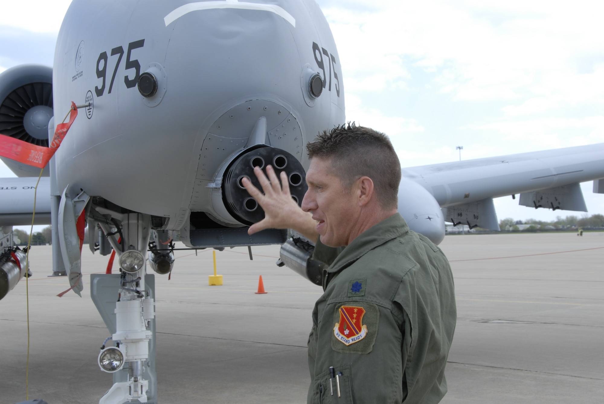 Lt. Col. Doug Champagne, commanding officer of the 107th Fighter Squadron, Selfridge Air National Guard Base, discusses the firepower that the A-10 Thunderbolt II aircraft can bring to the close air support mission. The 107th launched its ceremonial first flight in the A-10 on May 2, completing the conversion from flying F-16 Fighting Falcons. The 30 mm GAU-8/A seven-barrel Gatling gun is one of the A-10’s most noticeable features. (U.S. Air Force photo by Technical Sgt. David Kujawa) 