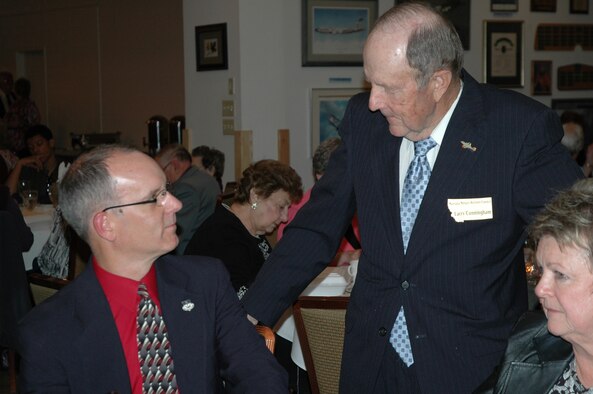 Col. Michael Fortney, 341st Missile Wing Commander (left), listens to retiree Larry Cunningham during the social hour preceding the Retirees Appreciation Dinner April 25 at the Grizzly Bend Club. Colonel Fortney was the guest speaker at the event. (U.S. Air Force photo/Valerie Mullett)
