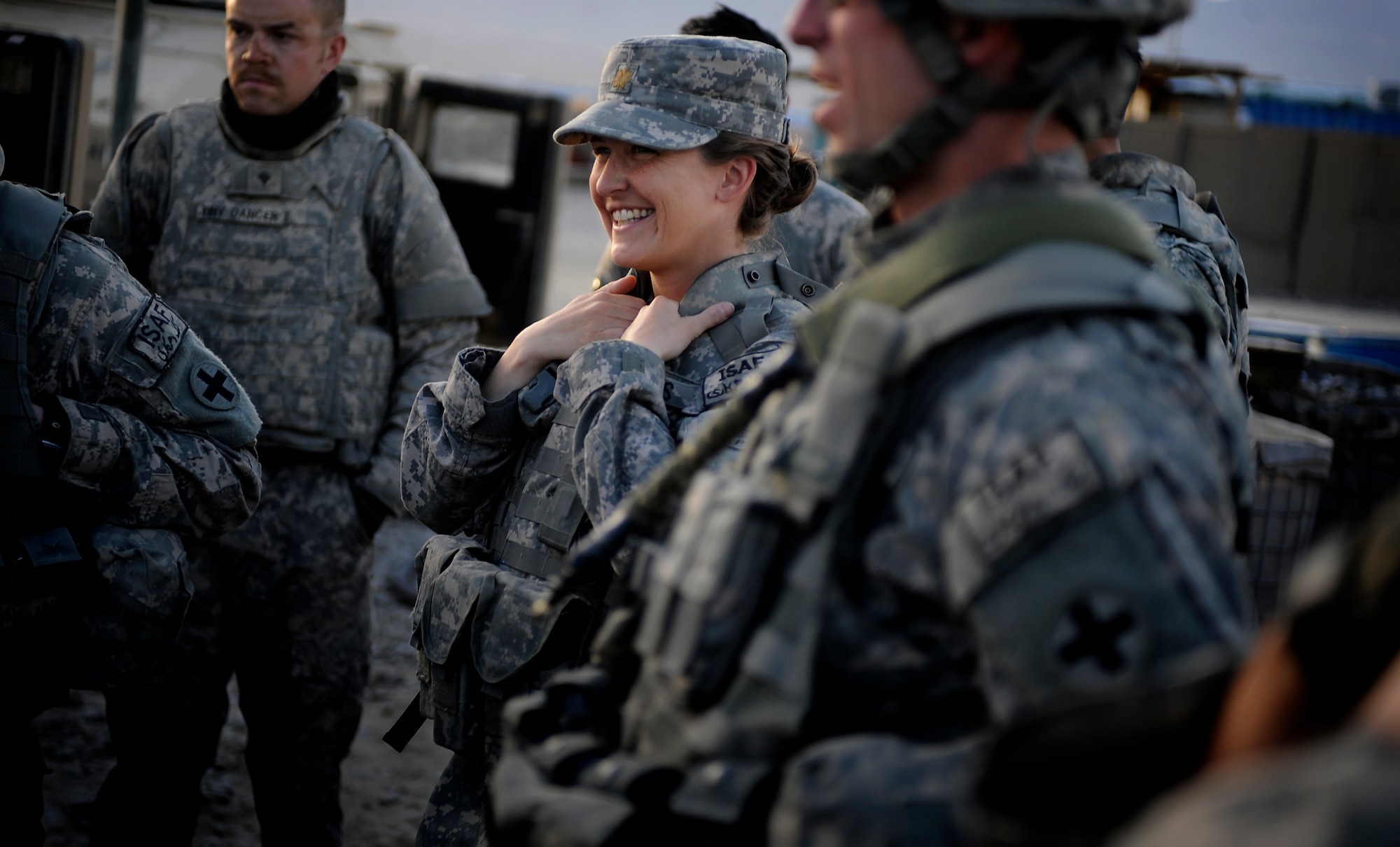 U.S. Air Force Maj. Kimberly Riggs, the engineer officer in charge of the Paktya Provincial Reconstruction Team, shares a lighter moment with Soldiers of the Paktya Provincial Reconstruction Team Security Forces Platoon, Forward Operating Base Gardez, Afghanistan, April 13, 2009. (U.S. Air Force photo by Staff Sgt. Shawn Weismiller)