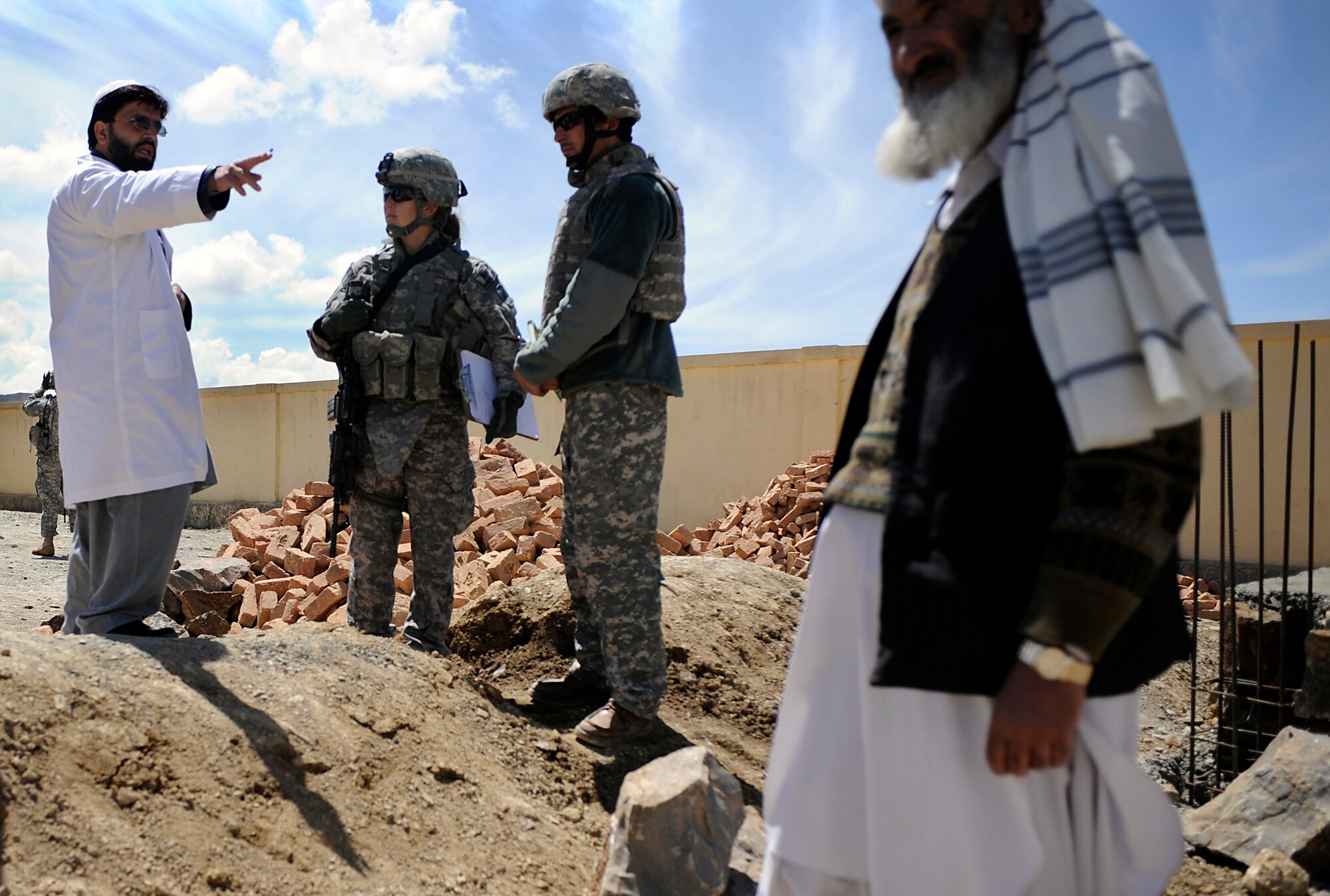 U.S. Air Force Maj. Kimberly Riggs, the engineer officer in charge of the Paktya Provincial Reconstruction Team, speaks with  the director of The Sayed Karam Female Medical Providers Quarters about current construction projects intended to improve the facility's ability to house female doctors and midwives in Gardez City, Afghanistan, April 13, 2009. (U.S. Air Force photo by Staff Sgt. Shawn Weismiller)