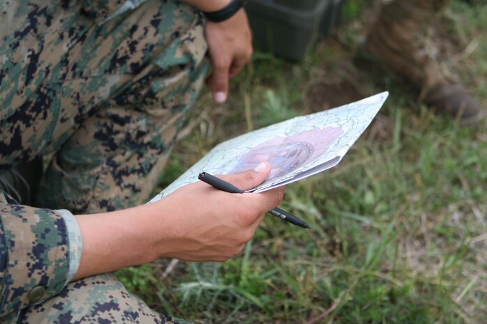 A Marine from 81mm Mortar Platoon, Weapons Company, 2nd Battalion, 2nd Marine Regiment, 2nd Marine Division, logs the impact location of mortar fire during a live fire training exercise, here, May 4.  (Official U.S. Marine Corps photo by Lance Cpl. James W. Clark)(RELEASED)