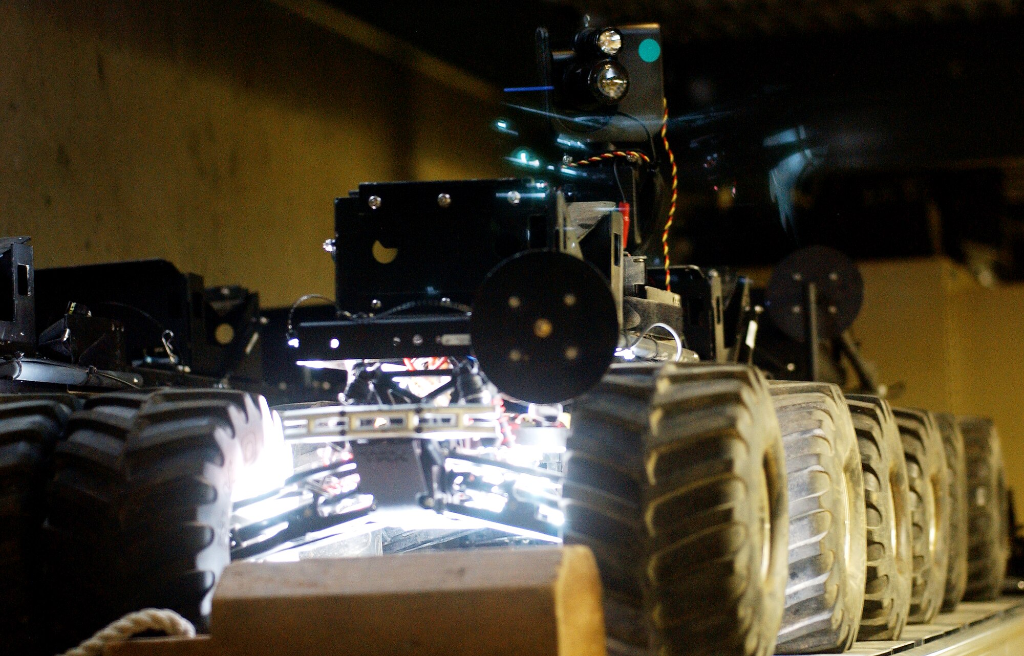 The bombot is a remote controlled vehicle developed to provide the explosive ordnance disposal unit the capabilities to deploy a 10 pound explosive countermeasure to an improvised explosive device or unexploded ordnance. (U.S. Air Force photo/Tech. Sgt. Rey Ramon)  