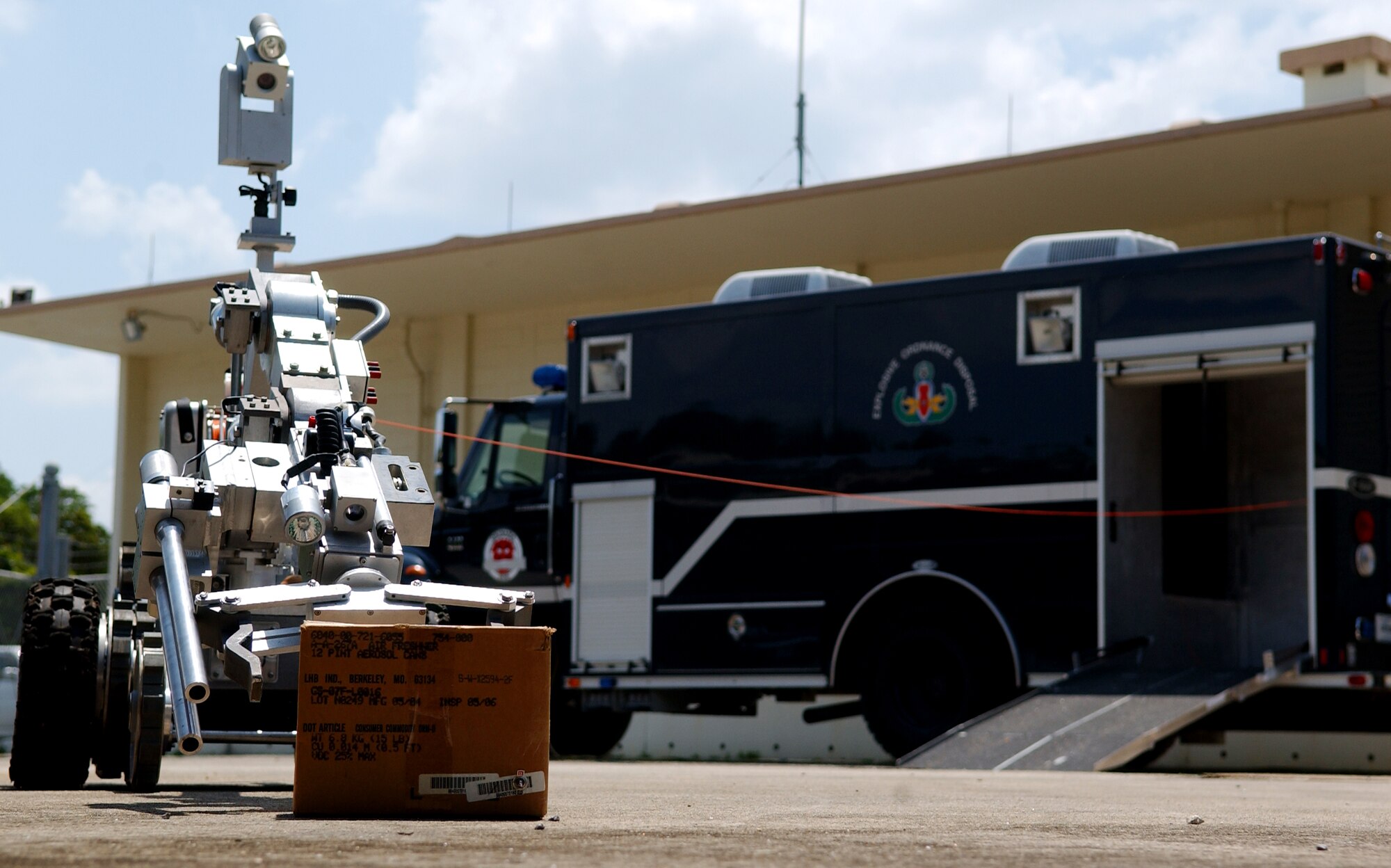 Members of the 18th Civil Engineer Squadron explosive ordnance disposal unit demonstrate the use of an F6A robot approaching a simulated improvised explosive device.    (U.S. Air Force photo/Tech. Sgt. Rey Ramon)   