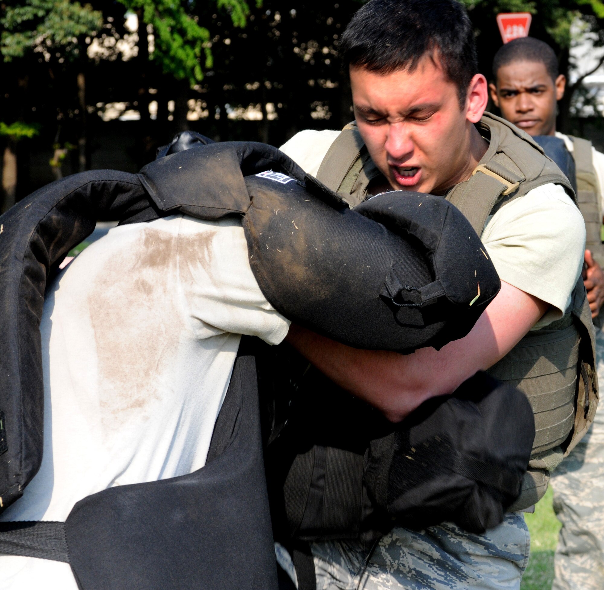YOKOTA AIR BASE, Japan -- Airman 1st Class Andrew Stout, 374th Security Forces Squadron, works on his technique April 30 during combative training. The training, based on pressure point control and physical apprehension restraint techniques, is an annual requirement for security forces members here. (U.S. Air Force photo/Airman 1st Class Michael Dillon)
