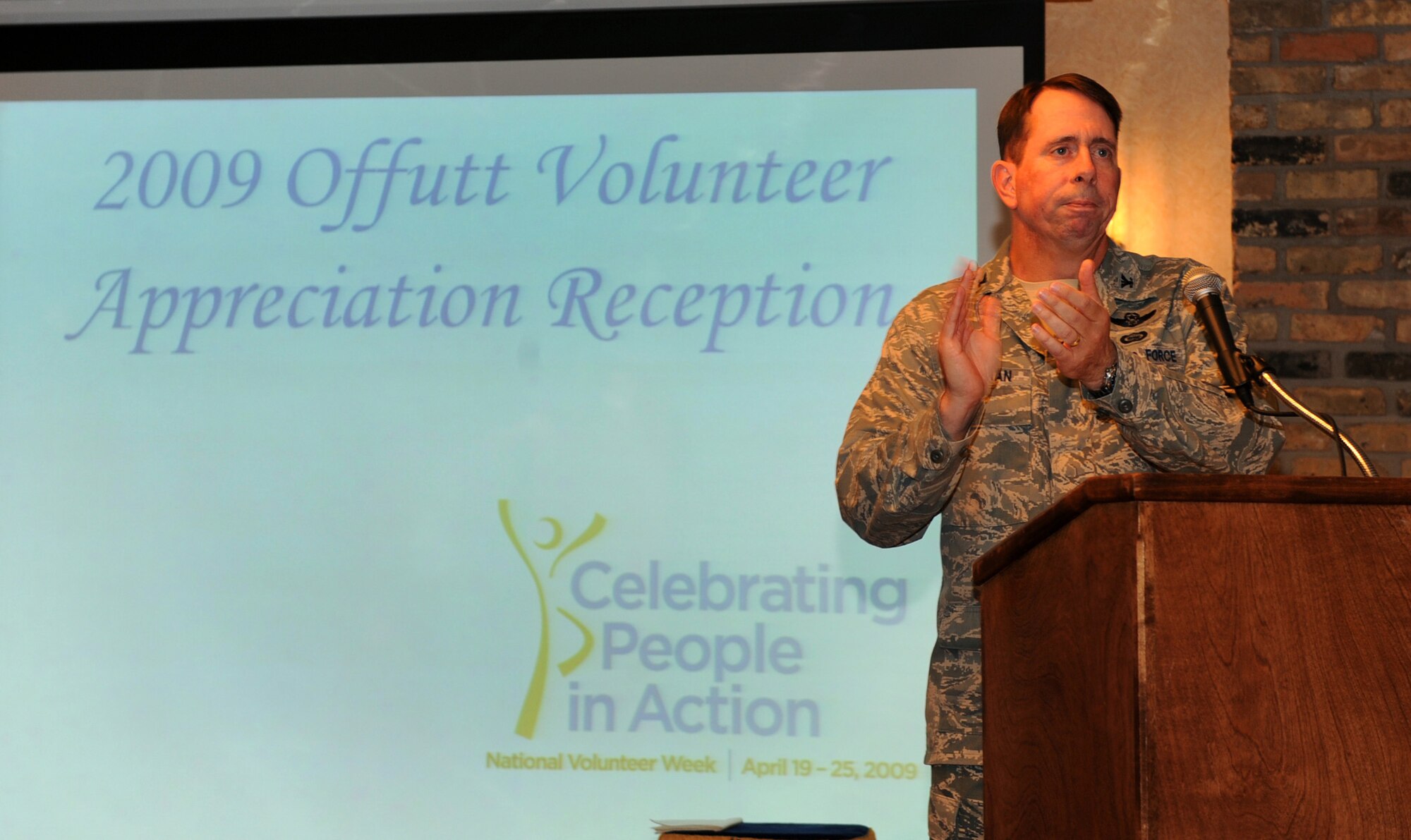 OFFUTT AIR FORCE BASE, Neb. - Col. John N.T. Shanahan, 55th Wing commander, applaudes the service of every volunteer during the  Volunteer Appreciation Reception at the Community Activity Center here April 29. The annual event recognizes the sacrafices volunteers make and honors them for their commitment to helping others. U.S. Air Force Photo by Josh Plueger