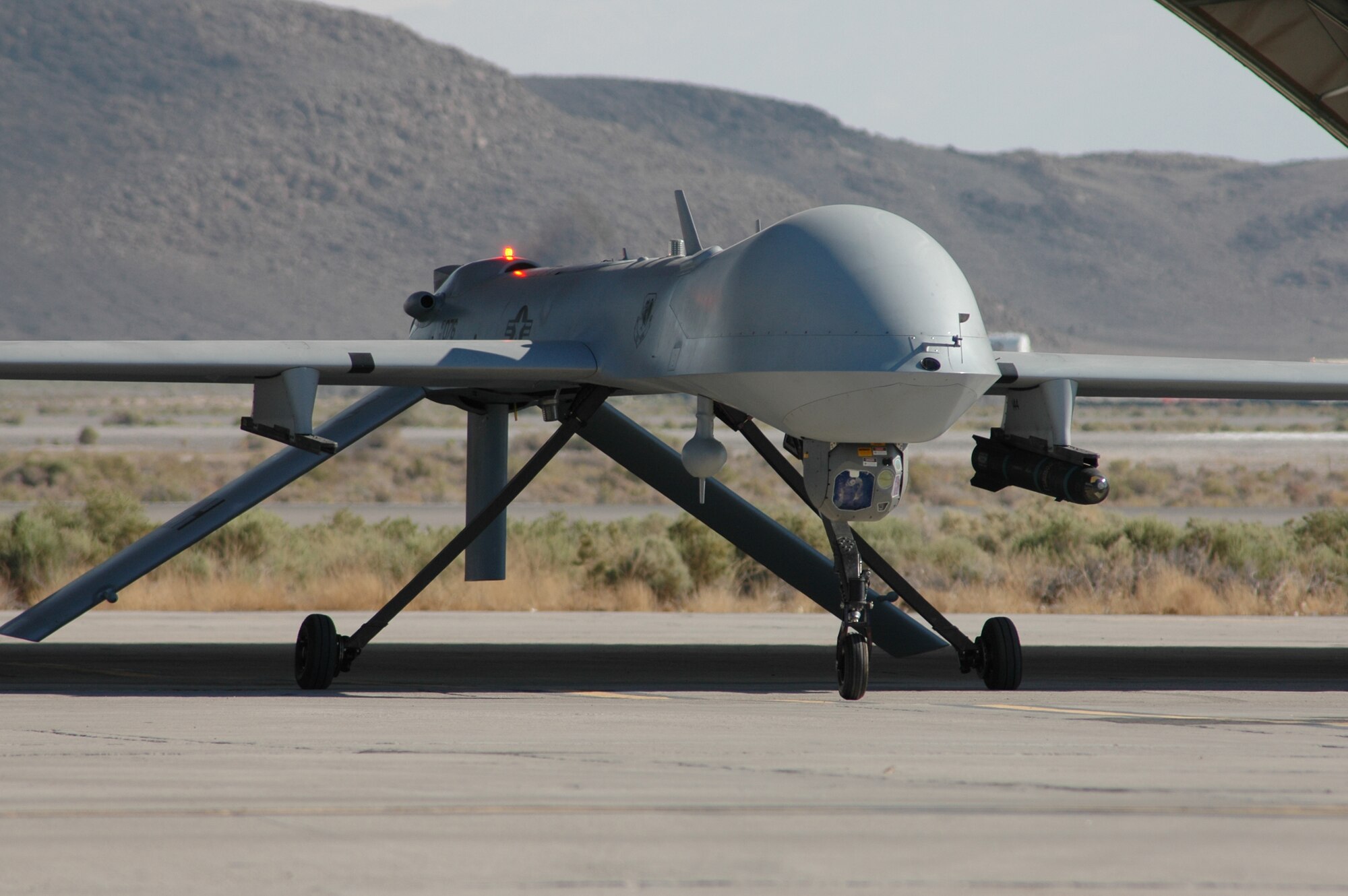 CREECH AFB, Nev. -- An MQ-1B Predator taxis at Creech AFB, Nev. June 25, 2008. The 15th Reconnaissance Squadron is one of the first armed UAS squadrons, providing combatant commanders with persistent ISR, full motion video, and precision weapons employment. (Photo by Steve Huckvale)