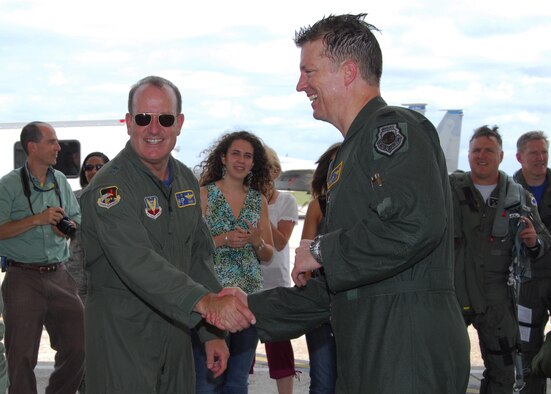 Col. Randy Spear, 601st Air and Space Operations Center vice commander, is greeted by Maj. Gen. Hank Morrow, Continental U.S. NORAD Region and Air Forces Northern commander, as he lands his F-15 after taking his final flight. (Air Force Photo by: Ms. Lisa Norman)