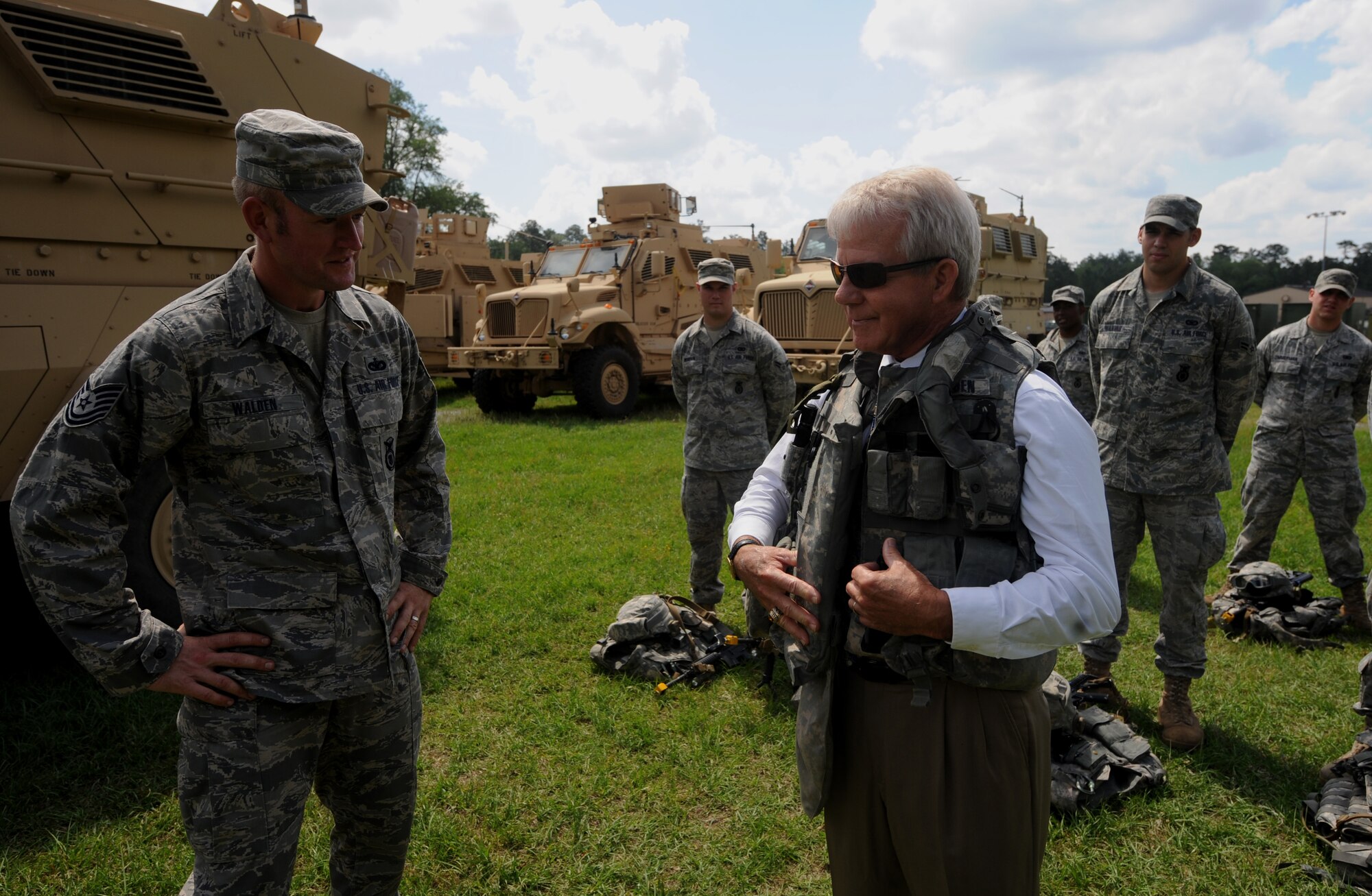 MOODY AIR FORCE BASE, Ga. -- Tech. Sgt. Jason Walden, 822nd Security Forces Squadron, speaks with an Honorary Commander about the weight of field gear during the Honorary Commander Day visit here April 30. Events during the visit included the opportunity to process through a pre-deployment line, fly in an HC-130P/N Combat King aircraft and see how military operations are performed while in the area of responsibility. (U.S. Air Force photo by Senior Airman Gina Chiaverotti)