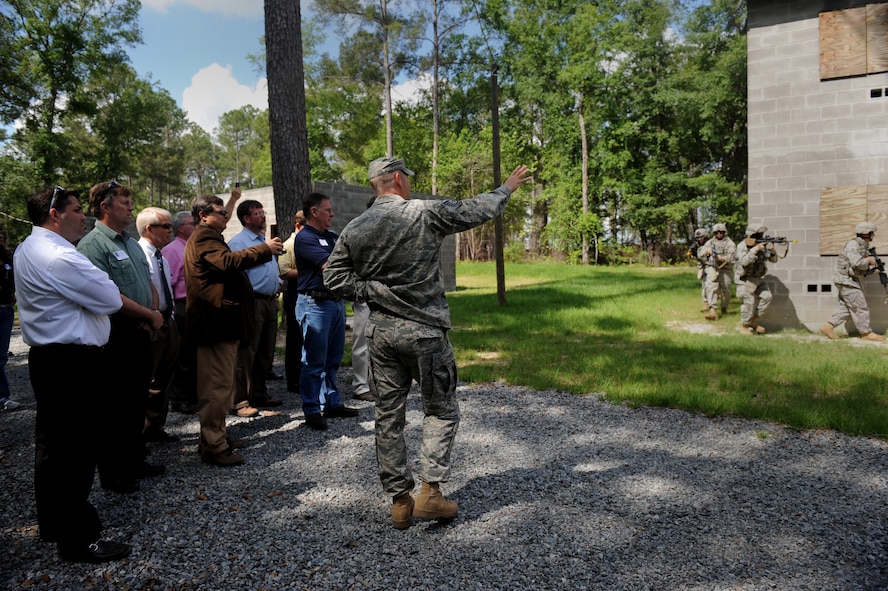 MOODY AIR FORCE BASE, Ga. -- Tech. Sgt. Donald Gallagher, 820th Security Forces Group, explains to the 23rd Wing Honorary Commanders the tactics Airmen use when engaging in military operations in urban terrain village training scenarios during the Honorary Commander’s Day here April 30. The program allows local community leaders the opportunity to participate in special events, programs and activities sponsored by their honorary squadron. (U.S. Air Force photo by Senior Airman Gina Chiaverotti)