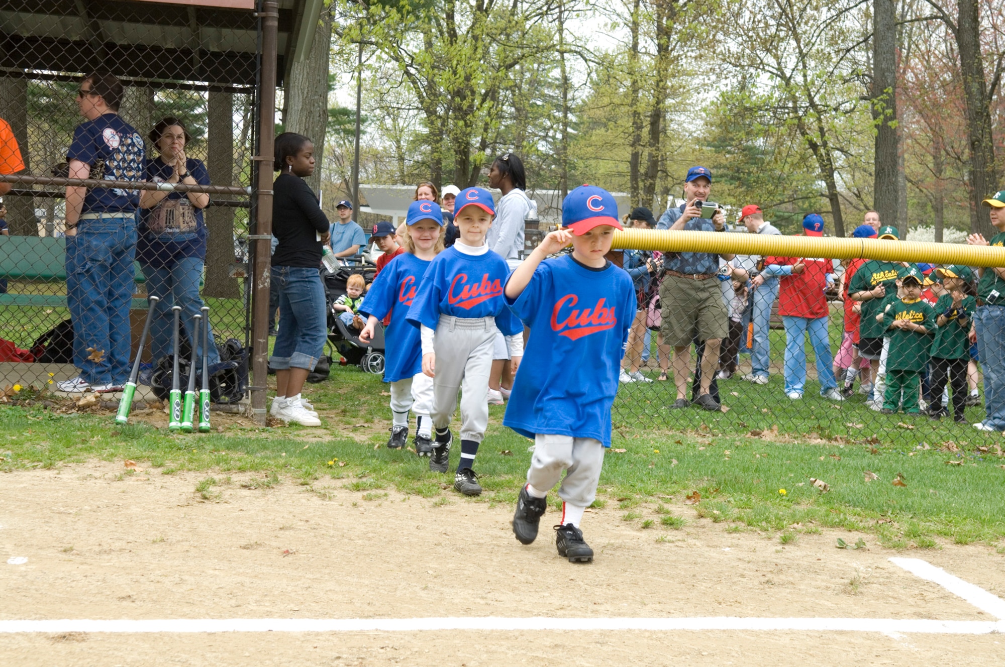 HANSCOM AIR FORCE BASE, Mass. –The Cubs take the field during the Hanscom Little League season opener on May 2. Col. Dave Orr, 66th Air Base Wing commander was on hand to throw out the first pitch of the season. (U.S. Air Force photo by Rick Berry)
