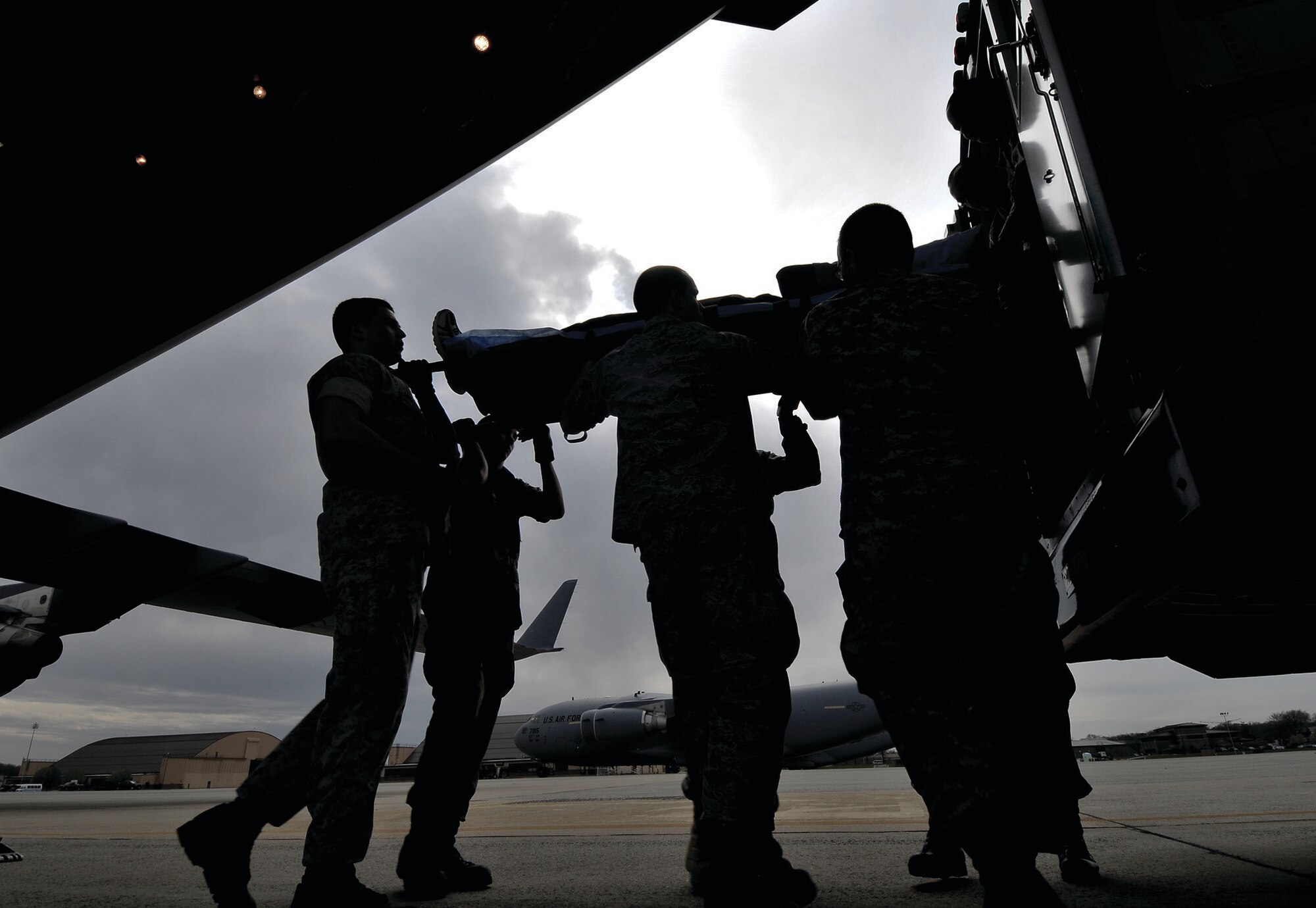 Medical technicians and nurses from the 779th Aeromedical Staging Facility move patients injured in Operations Iraqi and Enduring Freedom and others that need medical care in the U.S. (U.S. Air Force photo/ Tech. Sgt. Suzanne M. Day)