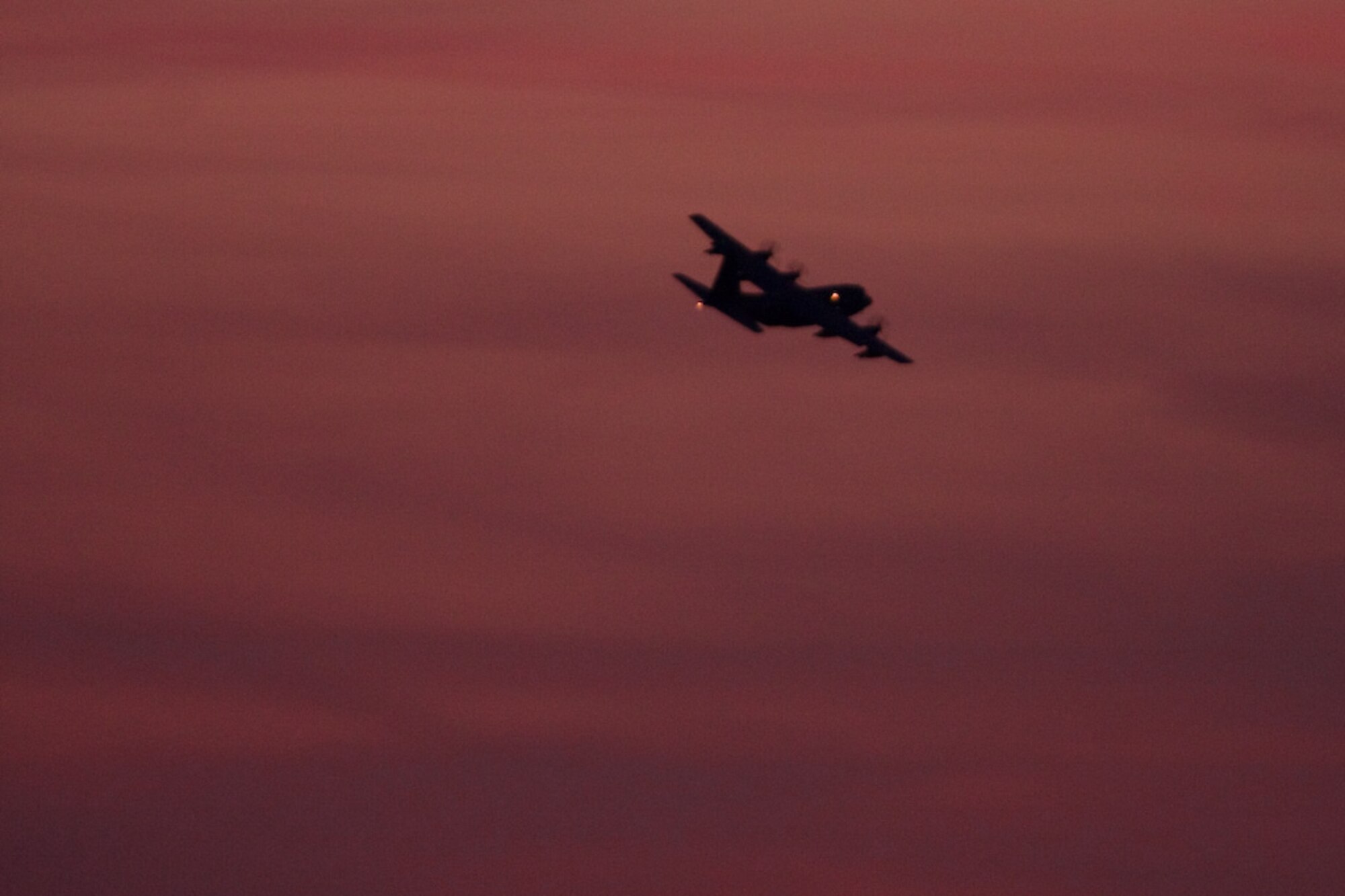 An MC-130P Combat Shadow aircraft carrying Airmen from the 129th Rescue Wing takes off from Moffett Federal Airfield, Calif., for a deployment to the Horn of Africa. Thirty Airmen from the 129th Rescue Wing departed on two MC-130P aircraft for a 40-day deployment to Djibouti, Africa, April 21, 2009. (Photo courtesy of Mr. Sagar Pathak, www.horizontalrain.com)