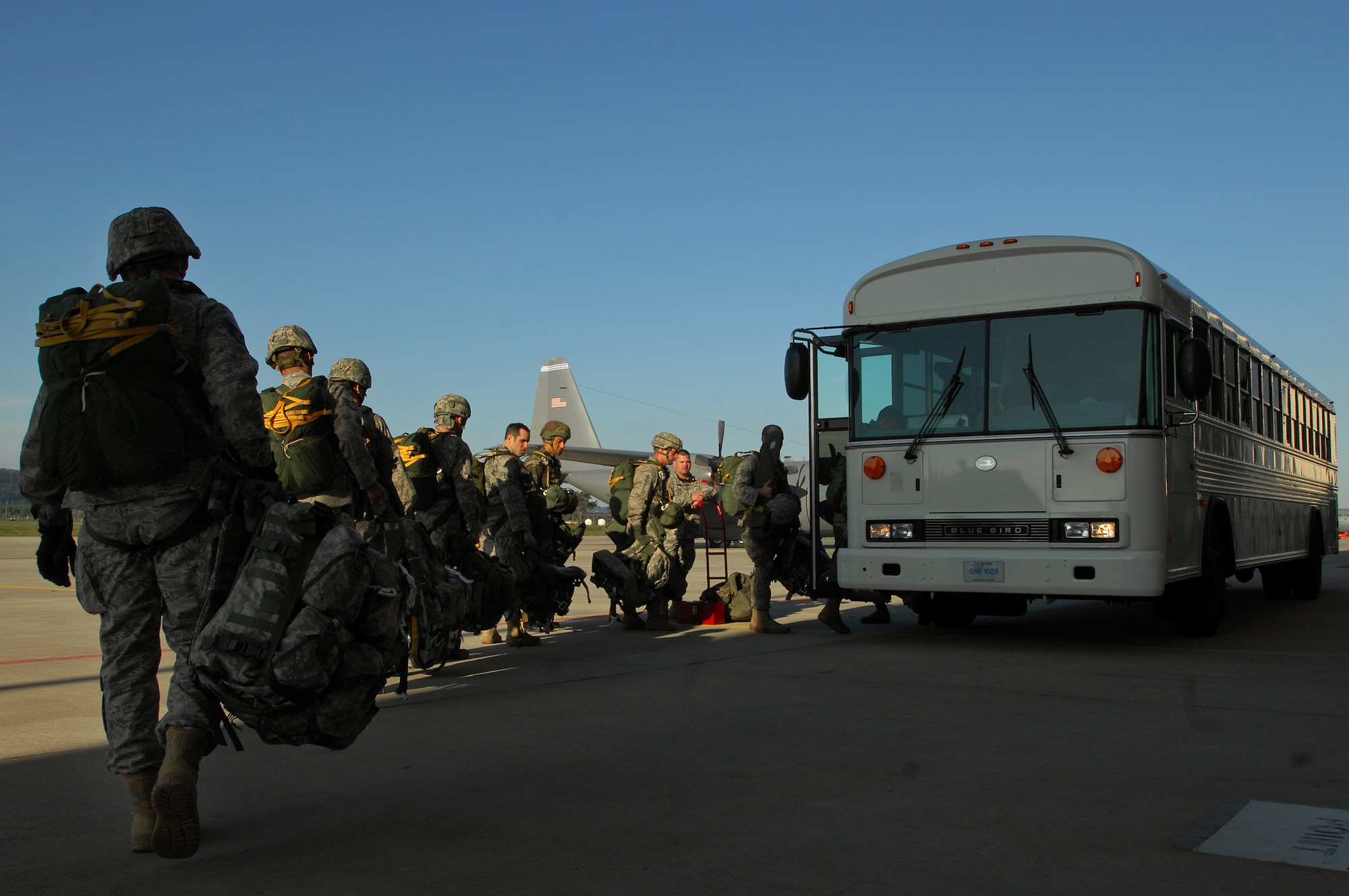 United States Air Force and Army paratroopers load a troop bus in preparation for the first C-130J Super Hercules personnel drop, May 4, 2009 Ramstein Air Base, Germany. (U.S. Air Force photo by Senior Airman Kenny Holston)
 
