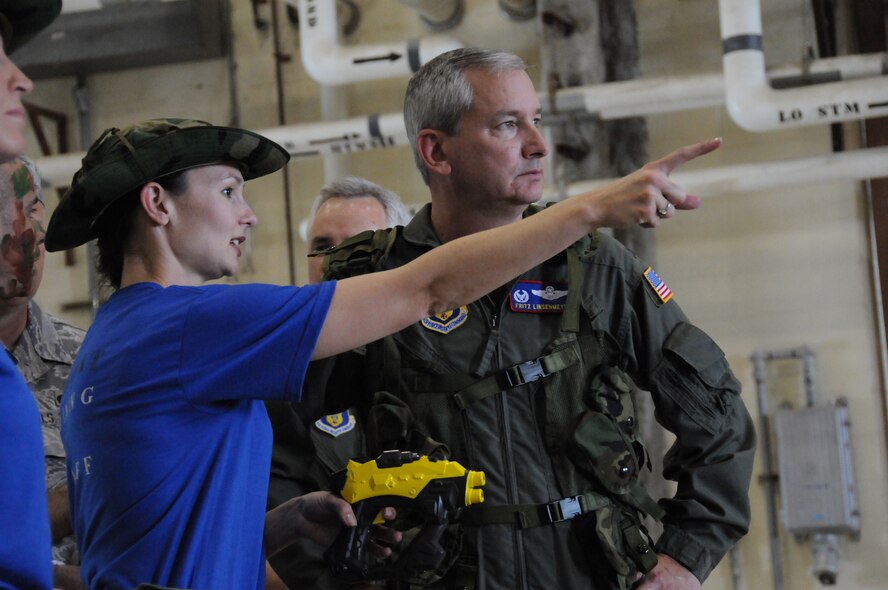 SEYMOUR JOHNSON AIR FORCE BASE, N.C. -- Capt. Kim Lewis, intelligence officer, briefs Col. Fritz Linsenmeyer, wing commander, on the layout and operations for friendly warfare during the 916th Air Refueling Wing's Combat Dining In. Capt. Lewis was one of the organizer's of the on-base event that hosted more than 175 reservists and active duty members.
