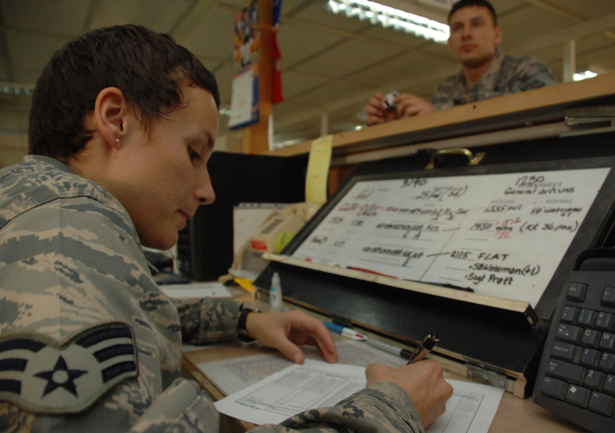 KIRKUK REGIONAL AIR BASE, Iraq – Then- Senior Airman Alexis Pierson, 506th Expeditionary Logistics Readiness Squadron, adds a soldier’s name to an aircraft manifest at the passenger terminal here in March. The St. Petersburg, Fla., native, deployed from the 70th Aerial Port Squadron, Homestead Air Reserve Base, Fla., helped process more than 11,500 passengers in and out of the base during her deployment. (U.S. Air Force photo by Senior Airman Jessica Lockoski)
