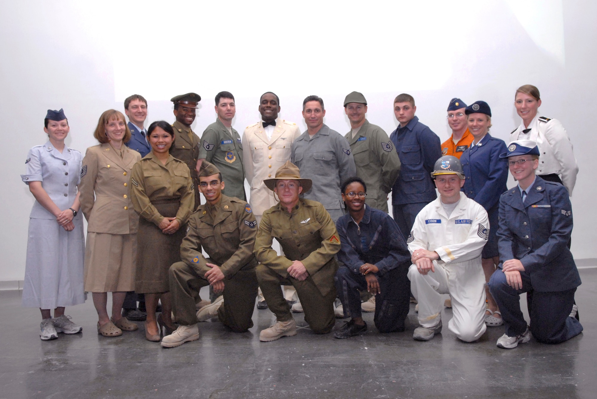 Airmen pose for a group photo during Operation Uniform Delta, Apr. 27, 2009 at an undisclosed location in Southwest Asia.  Operation Uniform Delta was an event displaying the history of the Air Force uniform and the changes that it underwent through the years.  The Airmen who participated in this event are deployed in support of Operations Iraqi and Enduring Freedom and Combined Joint Task Force - Horn of Africa.  (U.S. Air Force photo/Senior Airman Andrew Satran/released)