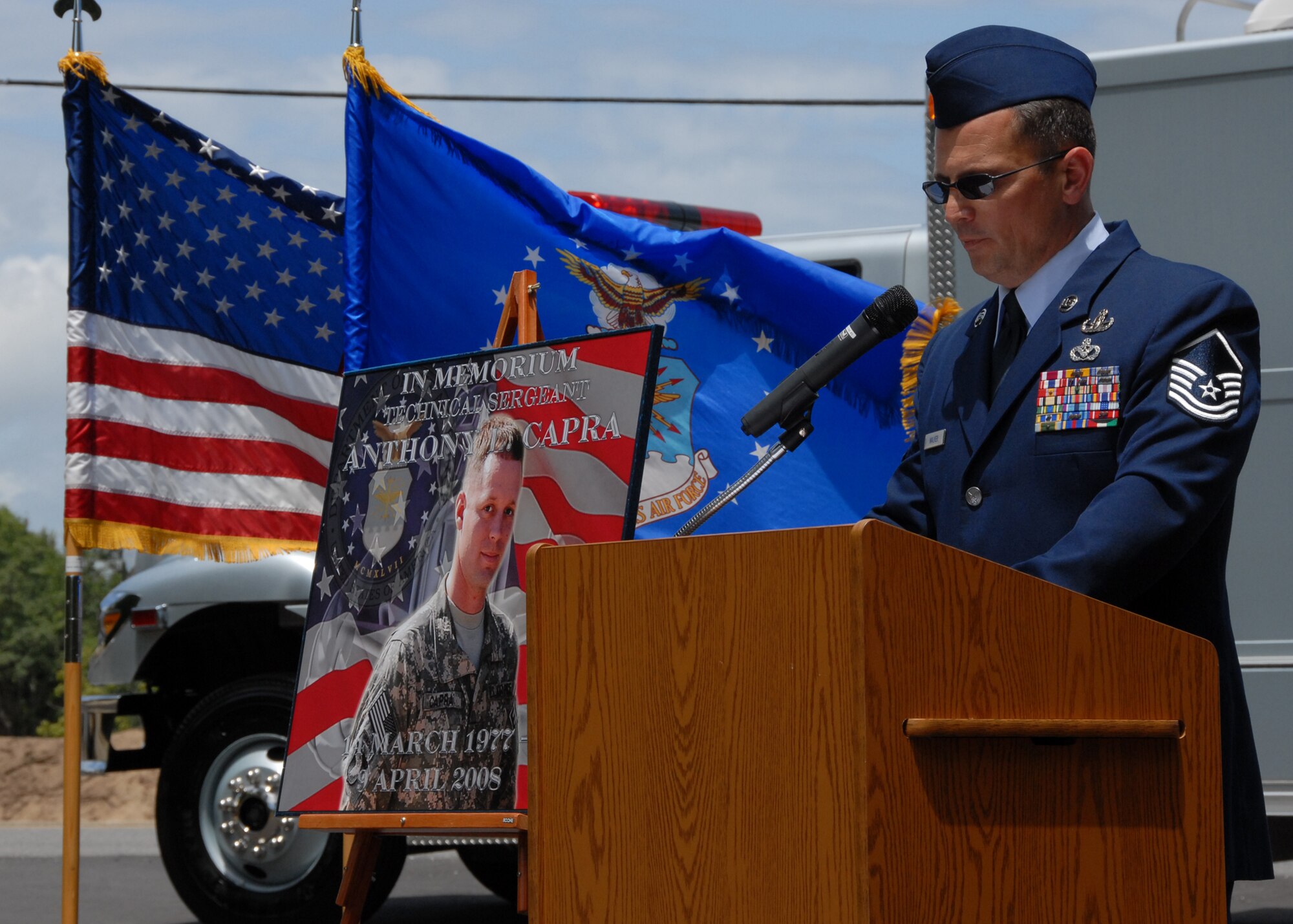 Master Sgt. Robert Walker led the ceremony here, May 1, to officially name a street after a fallen Explosive Ordnance Disposal Airman and former member of Team Eglin.  The street named after Tech. Sgt. Anthony Capra makes a loop around the new EOD facility.  Sergeant Capra died in Iraq in 2008.  U.S. Air Force photo/Samuel King Jr.