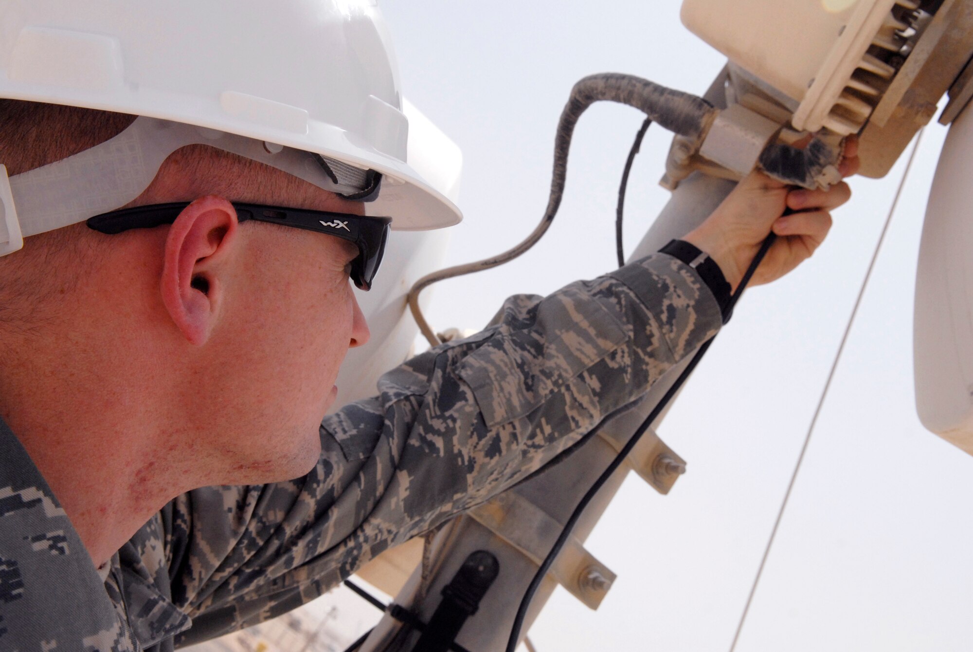 Senior Airman Michael Peyton, 379th Expeditionary Communications Squadron microwave communications technician, uses a voltmeter to check the signal strength and proper alignment of the microwave antenna, May 2, 2009, at an undisclosed location in Southwest Asia.  The microwave communications technicians provide voice and data via microwave transmission and equipment for microwave units used throughout forward operating locations in the U.S. Central Command's Area of Responsibility.  Airman Peyton hails from Copperas Cove, Texas and is deployed from Ramstein Air Base, Germany in support of Operations Iraqi and Enduring Freedom and Combined Joint Task Force - Horn of Africa.  (U.S. Air Force photo/Senior Airman Andrew Satran/released)