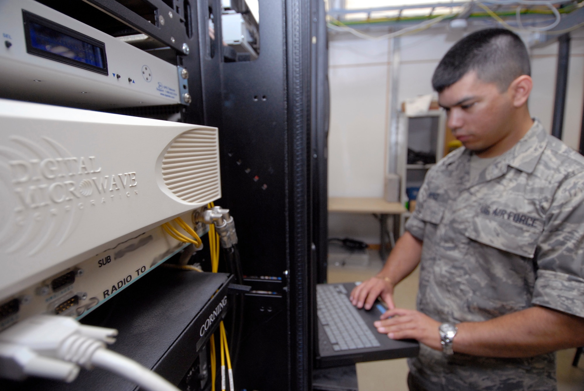 Senior Airman James Perez, 379th Expeditionary Communication Squadron microwave communication technician, checks and monitors sites to ensure the microwave antennas are providing the proper signal strength to send and receive data, May 2, 2009, at an undisclosed location in Southwest Asia.  The microwave communications technicians provide voice and data via microwave transmission and equipment for microwave units used throughout forward operating locations in the U.S. Central Command's Area of Responsibility.  Airman Perez hails from Salinas, Calif. and is deployed from Camp Zama, Japan in support of Operations Iraqi and Enduring Freedom and Combined Joint Task Force - Horn of Africa.  (U.S. Air Force photo/Senior Airman Andrew Satran/released)