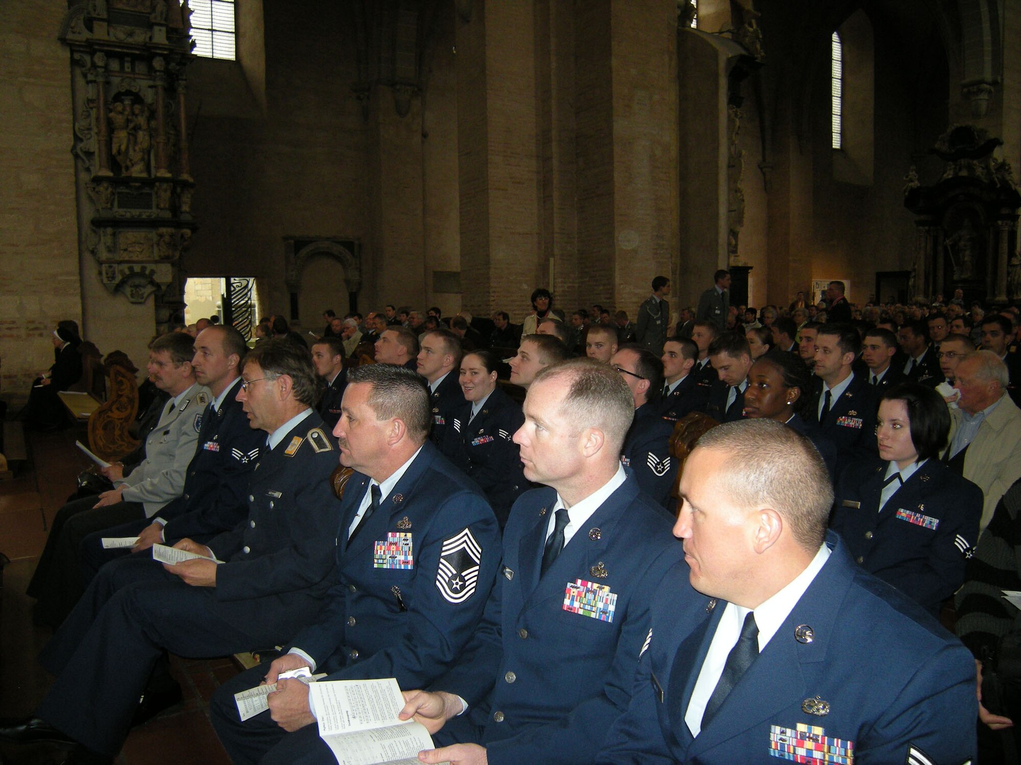 TRIER, Germany – Airmen from the 52nd Fighter Wing join German servicemembers and civilians for a “Holy Robe Days” World Day of Peace ceremony in the Trier Cathedral April 30, 2009. Once a year, the Trier diocese hosts the "Holy Robe Days" as the most important diocesan festival in Trier. People join in the celebrations, which include worship services, target group programs, conversations and meditation, cultural events and pilgrims' routes. (Photo by Connie Pitsch)