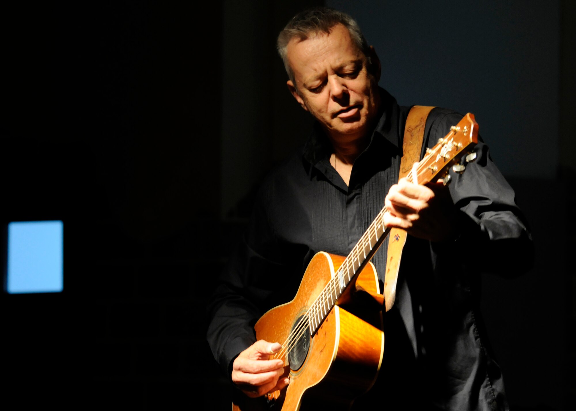 SPANGDAHLEM AIR BASE, Germany – Guitarist Tommy Emmanuel, two-time Grammy nominee, performs at the Brick House April 29, 2009. In addition to his 16 music and instructional recordings, Emmanuel is also an accomplished record producer and musical arranger. (U.S. Air Force photo by Airman 1st Class Staci Miller)