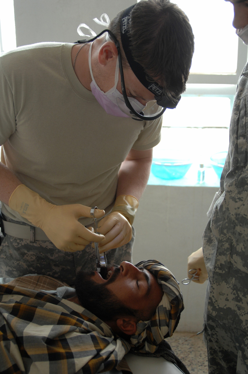 A Dental Specialist With Combined Joint Special Operations Task Force Afghanistan Conducts A Dental Examination On Maj demarcio reed o usarec, recruiting officer: a dental specialist with combined joint