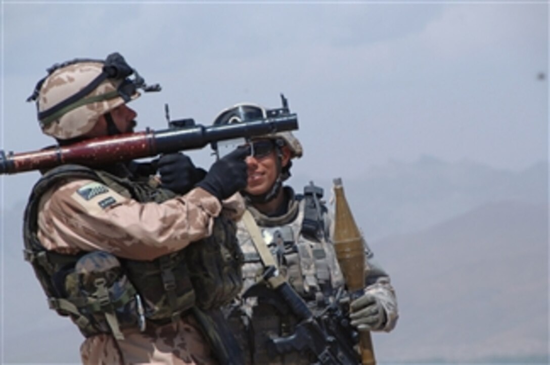 U.S. soldiers and airmen with 3rd Brigade, 10th Mountain Division, Explosive Ordnance Disposal, assigned to Task Force Spartan conduct heavy weapons training and clear the range of past unexploded ordnance at Forward Operating Base Shank in the Logar Province of Afghanistan on May 1, 2009.  