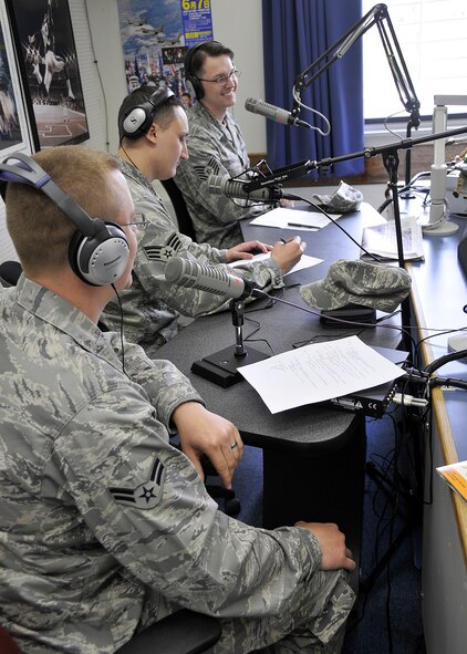 Airman 1st Class Donnie Long, Senior Airman Emrys Maier, and Tech Sgt. Erick Tyndall, all from the 35th Communications Squadron, offer live assistance on their radio show the "Geek Squad" May 1, 2009. The trio have performed over five radio shows together.  (U.S. Air Force photo by Senior Airman Chad Strohmeyer)