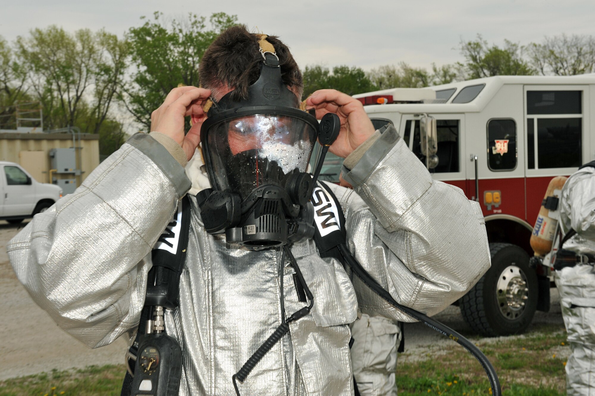 OFFUTT AIR FORCE BASE, Neb. -- Staff Sgt. Scott Harrington, 157th Civil Engineer Squadron, Pease Air National Guard Base, N.H. removes his respirator after participating in a portion of a firefighter training exercise. Firefighters from Offutt AFB, Eppley Field and guard and reserve units participated in a joint training exercise for disaster preparation here May 4. 
U.S. Air Force Photo by Charles Haymond
