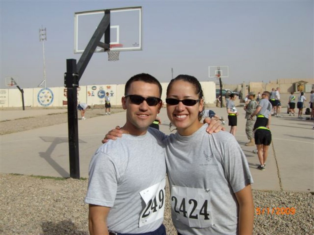 Tech. Sgt. Sam A. Ruiz and Senior Airman Sheryl N. Job, both from the 119th Wing Security Forces Squadron, North Dakota Air National Guard take a break before running in a 5K race in Iraq.  Ruiz is planning to run in the full Fargo Marathon from Iraq on May 9th.  
 
