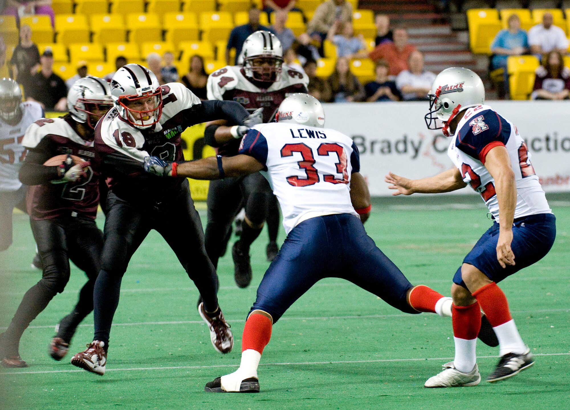 ANCHORAGE, Alaska--Tech. Sgt. Jeffrey Tongate blocks against Bloomington Extreme Lamar Lewis during a kick return May 4, 2009at the Sullivan Center. Tongate is a fire fighter from the 3rd Civil Engineer Squadronand he also plays on Alaska Wild, an indoor professional football team. (U.S. Air Force photo/Senior Airman Jonathan Steffen)  