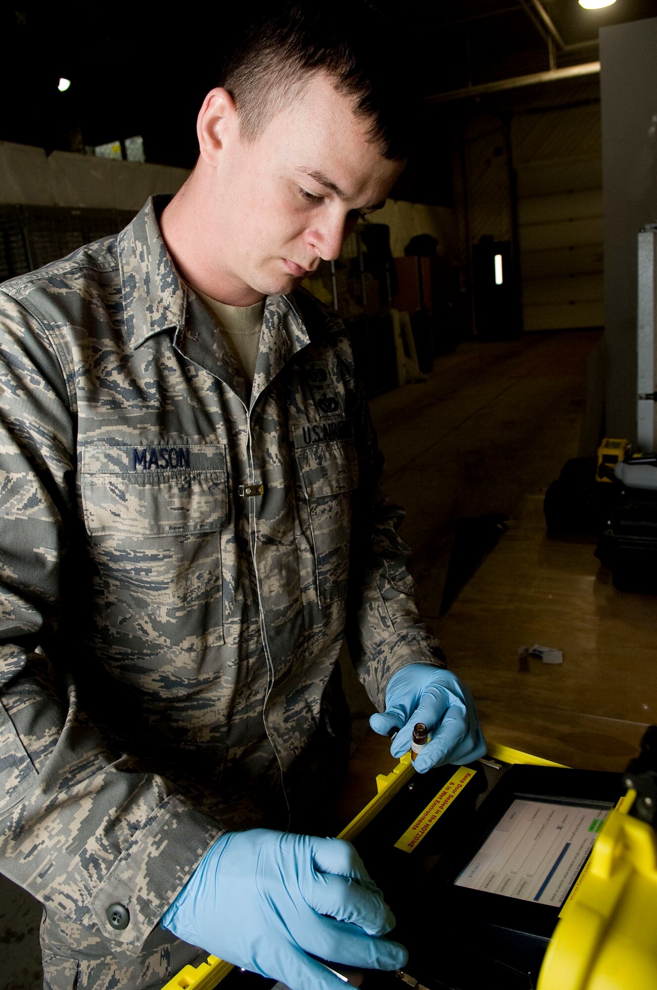 ELMENDORF AIR FORCE BASE, Alaska?Staff Sgt. Earl Mason system checks over a hazmat ID system April 27, 2009. Sgt. Mason is the non commission officer in charge of emergency management of logistics of 3rd Civil Engineer Squadron that also plays on Alaska Wild an indoor professional football team. (U.S. Air Force photo by Senior Airman Jonathan Steffen)  