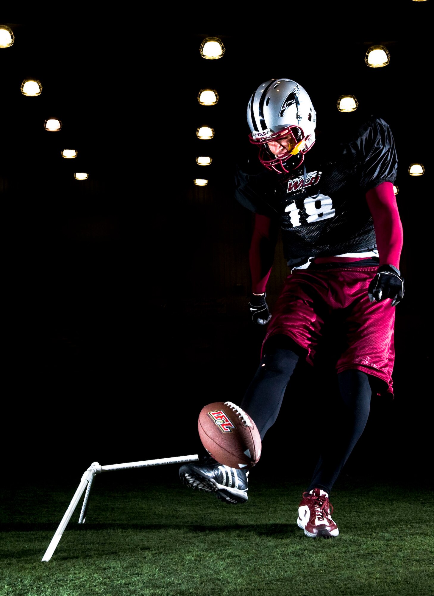 ANCHORAGE, Alaska--Tech. Sgt. Jeffrey Tongate kicks the ball during practice April 21, 2009. Tongate is a fire fighter from the 3rd Civil Engineer Squadron and he also plays for the Alaska Wild, an indoor professional football team. (U.S. Air Force photo/Senior Airman Jonathan Steffen)  