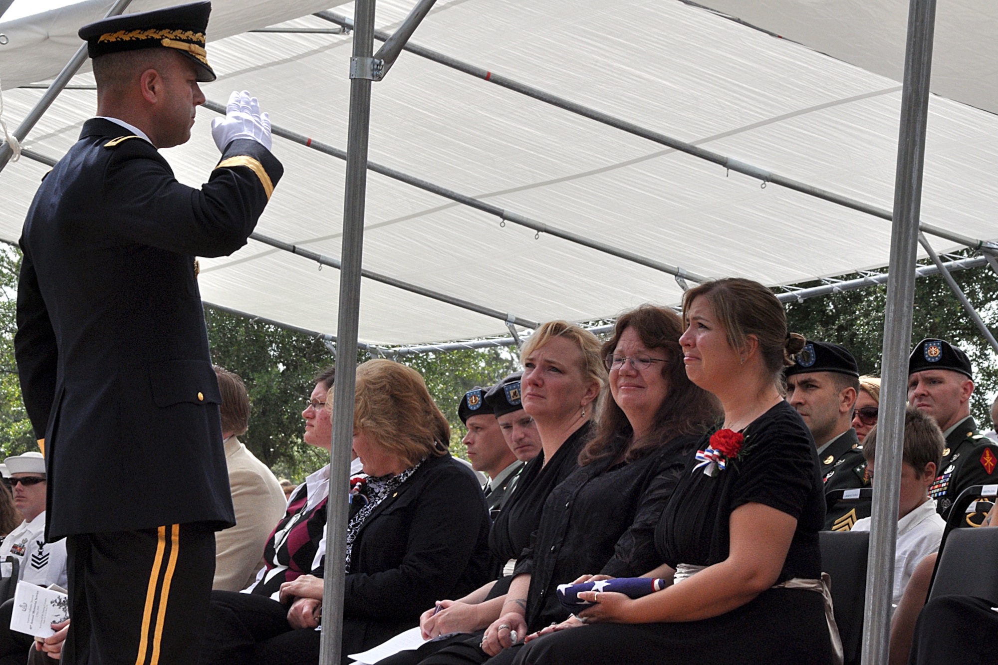 EGLIN AIR FORCE BASE, Fla. – Brig. Gen. Jeffrey Snow, 20th Support Command commander, renders a military salute to the family of Army Sergeant 1st Class Lawrence Ezell, an Explosive Ordnance Disposal technician who died in the line of duty April 30, in Baghdad. The ceremony was part of the 40th Annual EOD Memorial Service May 2 at the Kauffman EOD Training Complex. During the service, six servicemembers' names were added to the Memorial. The total now stands at 238 names. The men and women whose names are on the Memorial must be graduates of an approved EOD School who have given their lives on active duty as a result of an EOD mission since the declaration of World War II. (U.S. Air Force photo/ Airman Anthony Jennings)