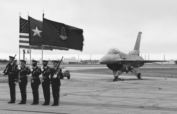 DYESS AIR FORCE BASE, Texas - The Dyess Air Force Honor Guard presented the colors to open the Big Country Airfest at the Abilene Regional Airport, May 2.  Despite the bad weather people came out to see the different static displays, vendors, and a chance to look inside the cockpits of the planes on the flight line.  Residents also saw air power in action with two Air Force jets performing a low-level fly over.  (U.S. Air Force photo by Staff Sgt. Connor Estes).  