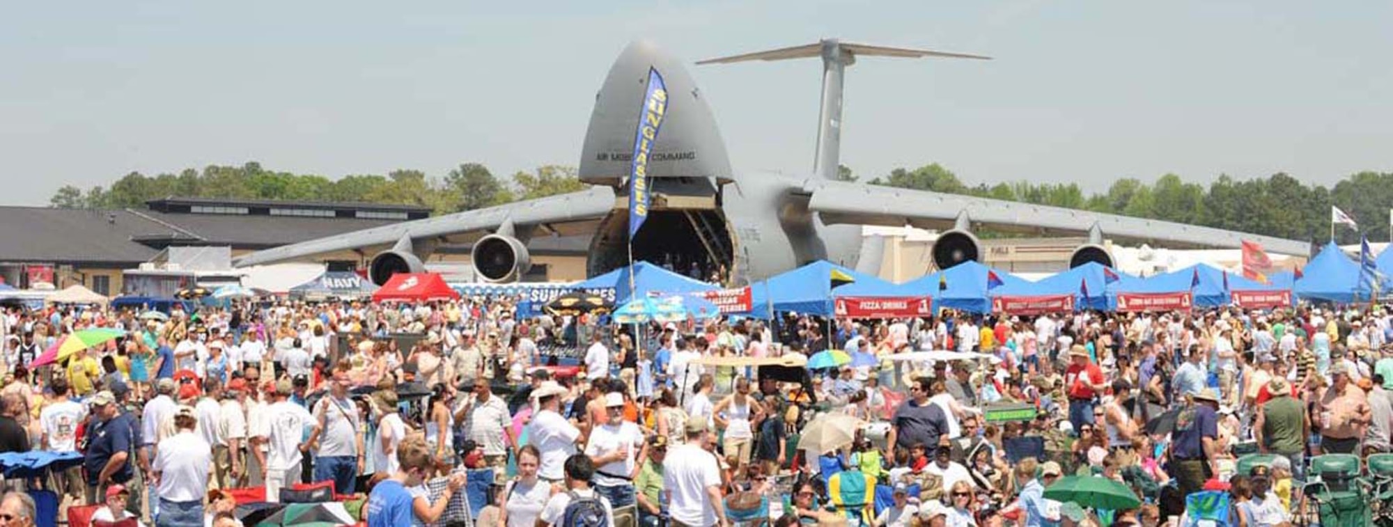 One of Dover?s C-5 Galaxys is available as a static display for more than 100,000 spectators to tour during the Wings over Wayne Airshow at Seymour Johnson Air Force Base, N.C., April 25. Static displays at air shows allow the public to tour and learn more about the capabilities of the C-5. A Dover C-5, along with a C-17 Globemaster III, will be available to the public during the Dover Air Force Base Open House June 20-21. (U.S. Air Force photo by Airman 1st Class Gino Reyes)  