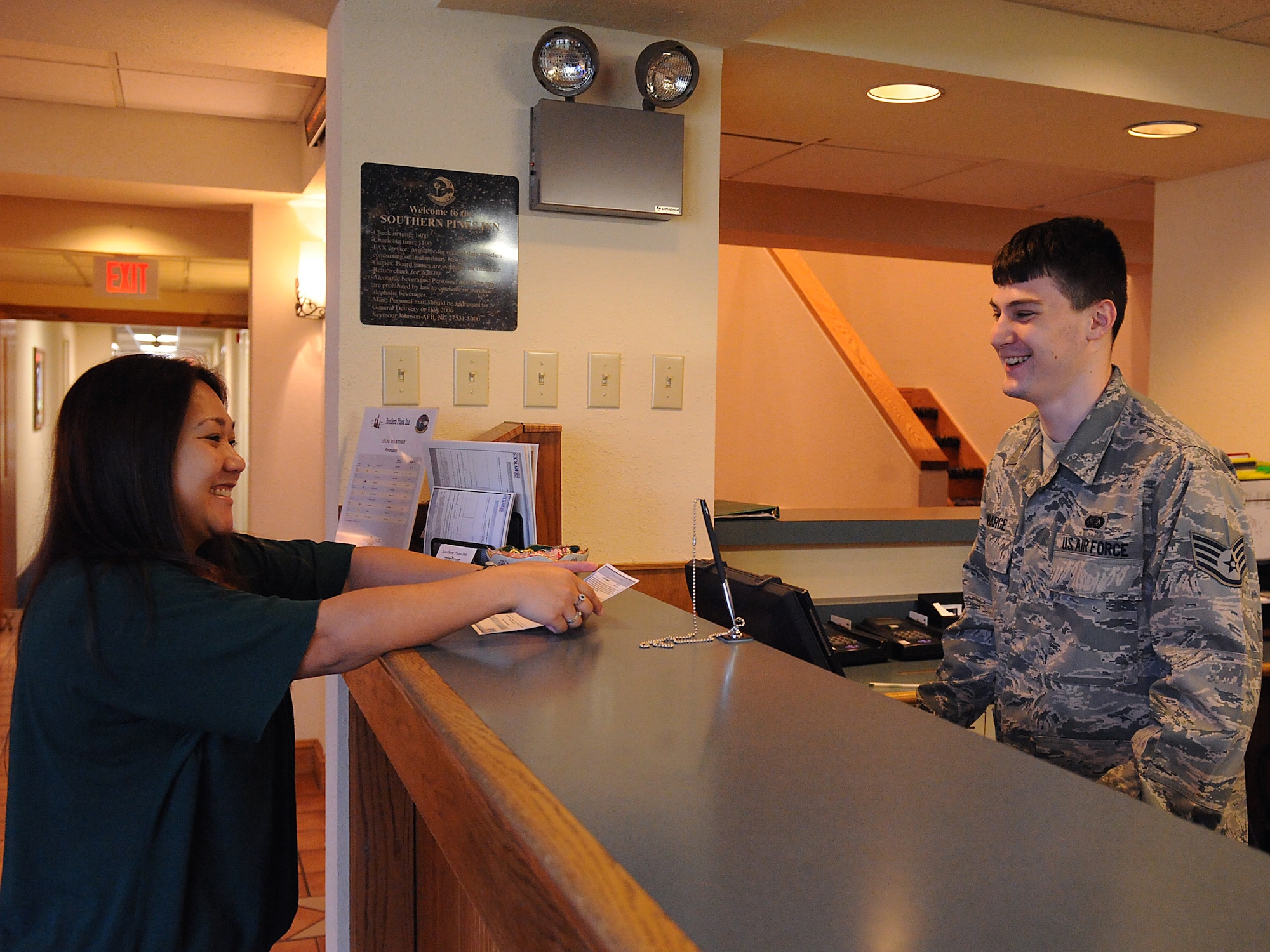 Staff Sgt. Benjamin Robarge, 4th Force Support Squadron, thanks Irene Nash for staying at the Southern Pines Inn at Seymour Johnson Air Force Base, N.C., April 14, 2009. As a customer service representative Sergeant Robarge strives to leave a good impression of the base to his customers through courtesy and providing helpful information. (U.S. Air Force photo by Airman 1st Class Whitney S. Lambert)