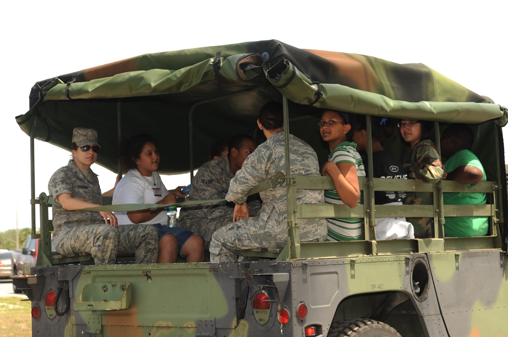 A group of Bigs/Littles take of tour on humvee?s during the ?Big for a Day? Celebration May 1, 2009.  The Big Brothers/Sisters program visits Macdill AFB annually to foster mentorship between local children and base populace, while becoming familiar with 6th Air Mobility Wing mission.  (U.S. Air Force photographer Senior Airman Nancy Hooks)