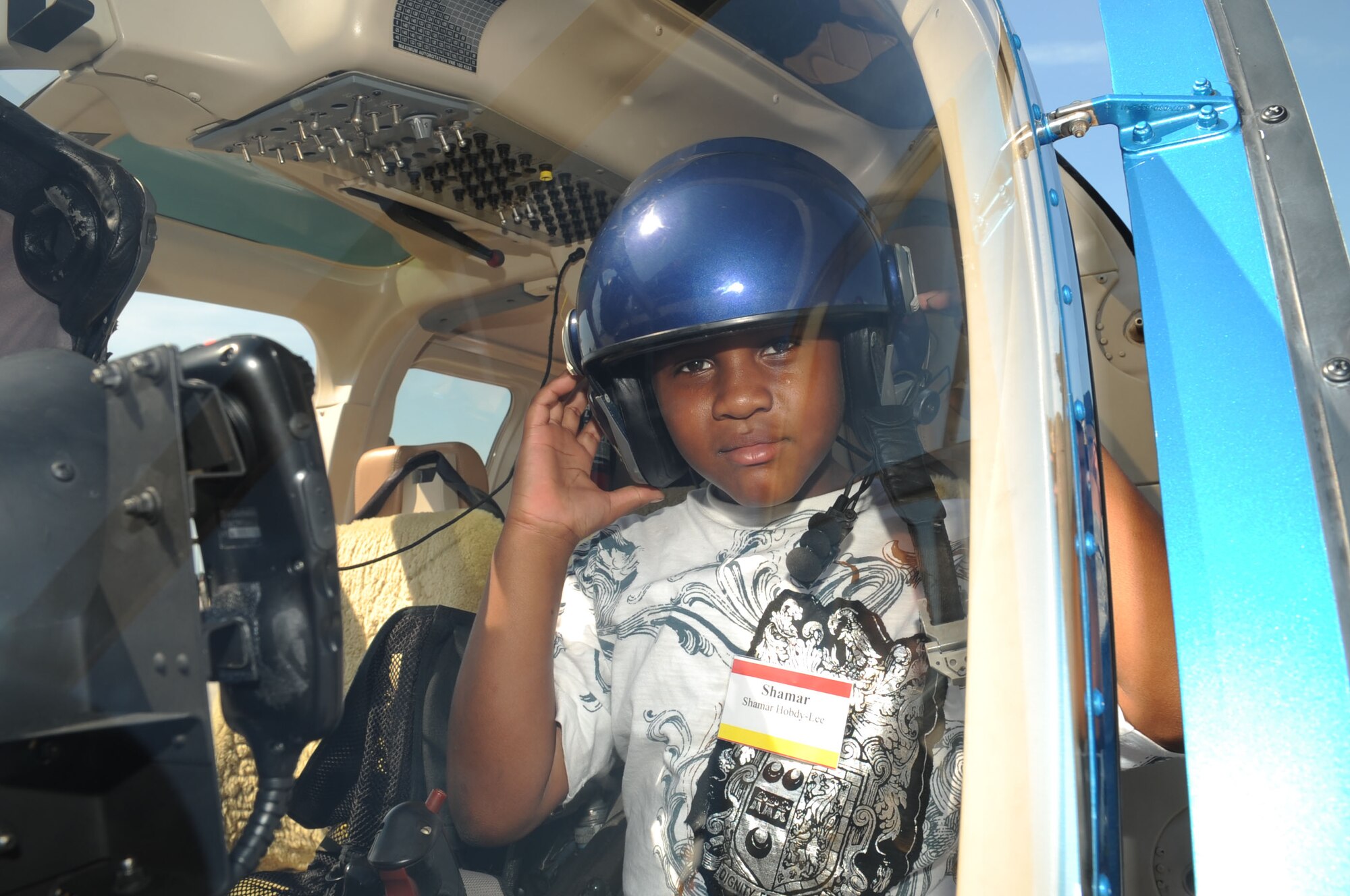 Shamar Hobdy-Lee boards the Tampa Police Department's Helicopter Demo during the Big for a Day celebration May 1.  Shamar's big is Senior Airman Tre Manning from the 6th Medical Operations Squadron. The Big Brothers/Sisters program visits Macdill AFB annually to foster mentorship between local children and base populace, while becoming familiar with 6th Air Mobility Wing mission.