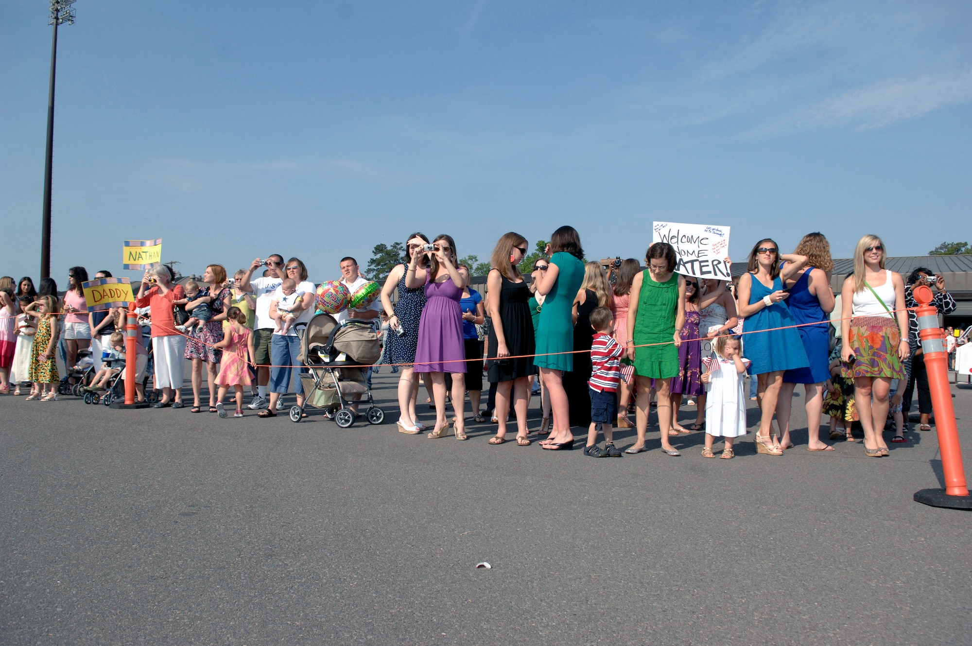 Family and friends wait to reunite with Airmen from the 16th Airlift Squadron May 3 at Charleston Air Force Base, S.C. More than 140 Airmen from the 16th AS returned from their 120-day deployment to the Middle East in support of operations Enduring Freedom and Iraqi Freedom and operations in the Horn of Africa. (U.S. Air Force photo/James M. Bowman) 