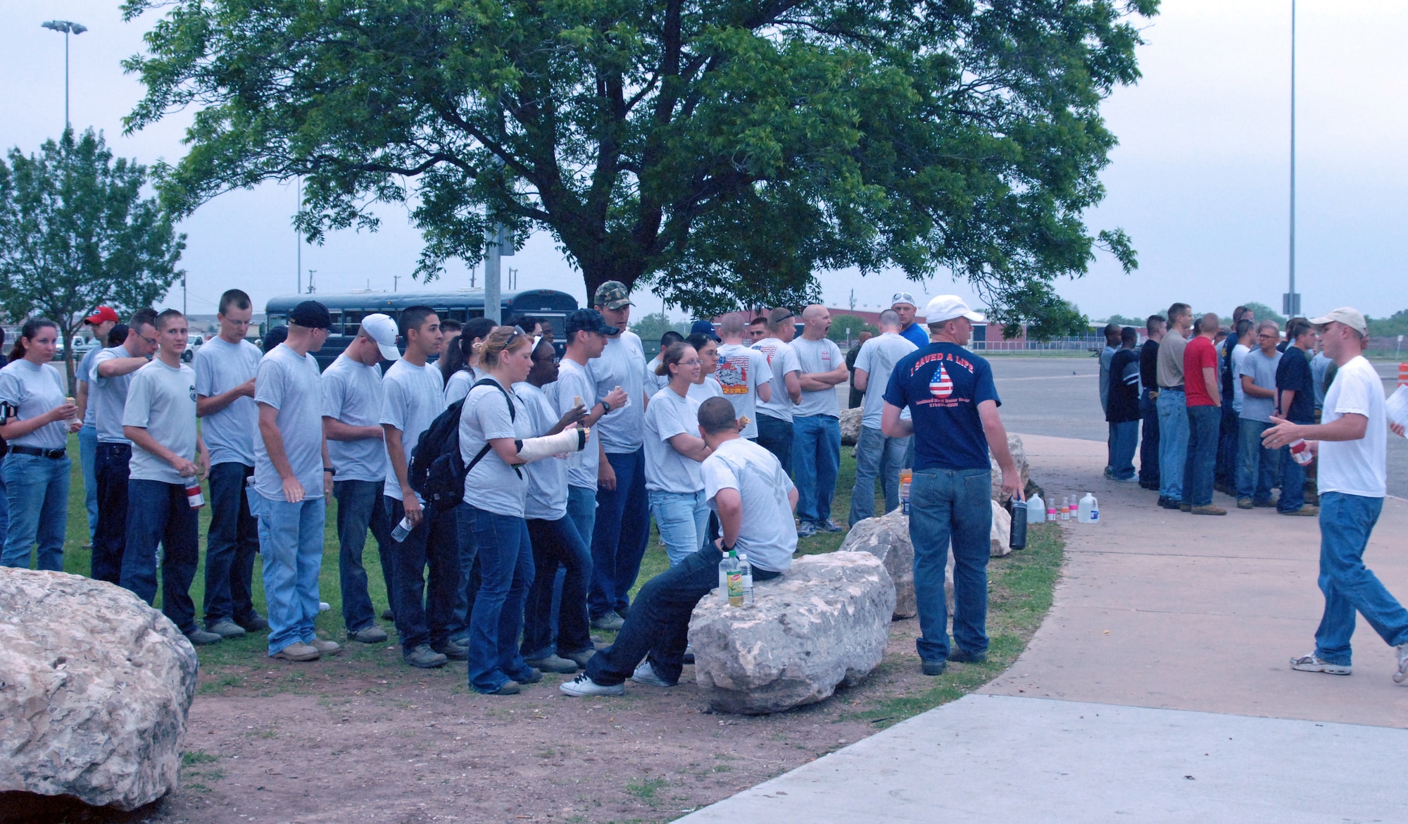 Almost 100 Airmen and Marines from Goodfellow Air Force Base form up and await assignments for a portion of the annual month-long Great American Cleanup, the nation's largest community improvement program May 2.   As part of the Keep San Angelo Beautiful program, Team Goodfellow members took part in the large trash drop and recycling event held at the San Angelo Coliseum, Texas.  (U.S. Air Force photo by Senior Master Sgt. Robert Martinez)