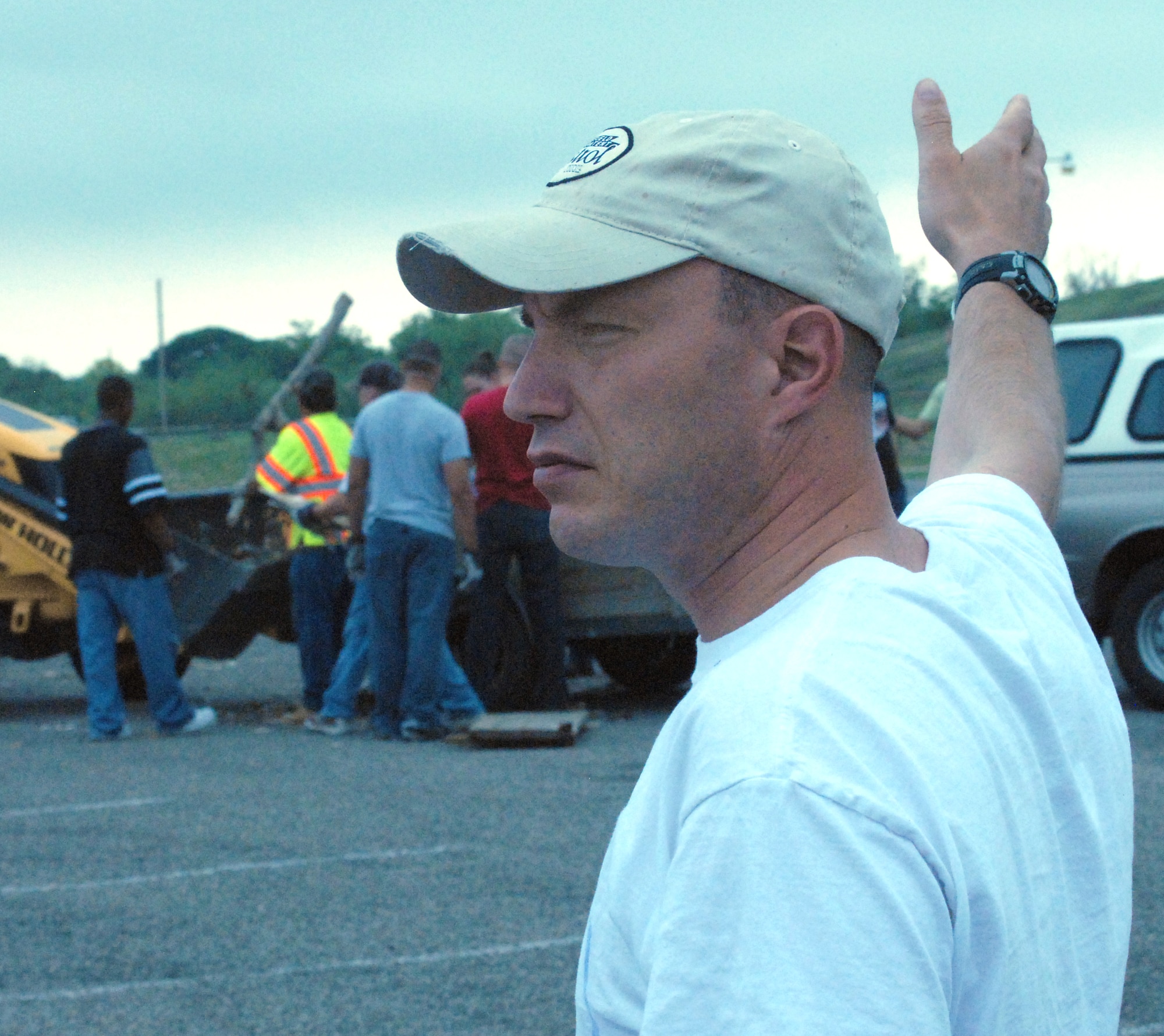 U.S. Marine Staff Sgt. Timothy Muckey-Quizado,  Marine Corps Detachment, Goodfellow Air Force Base guides vehicles to one of the many trash drop off and recycling stations.  Staff Sgt. Muckey-Quizado led a team of Marines who assisted the almost 100 Airmen and Marines from Goodfellow who lent a hand for a portion of the annual month-long Great American Cleanup May 2, the nation's largest community improvement program.   As part of the Keep San Angelo Beautiful program, Team Goodfellow members took part in the large trash drop and recycling event held at the San Angelo Coliseum, Texas.  (U.S. Air Force photo by Senior Master Sgt. Robert Martinez)