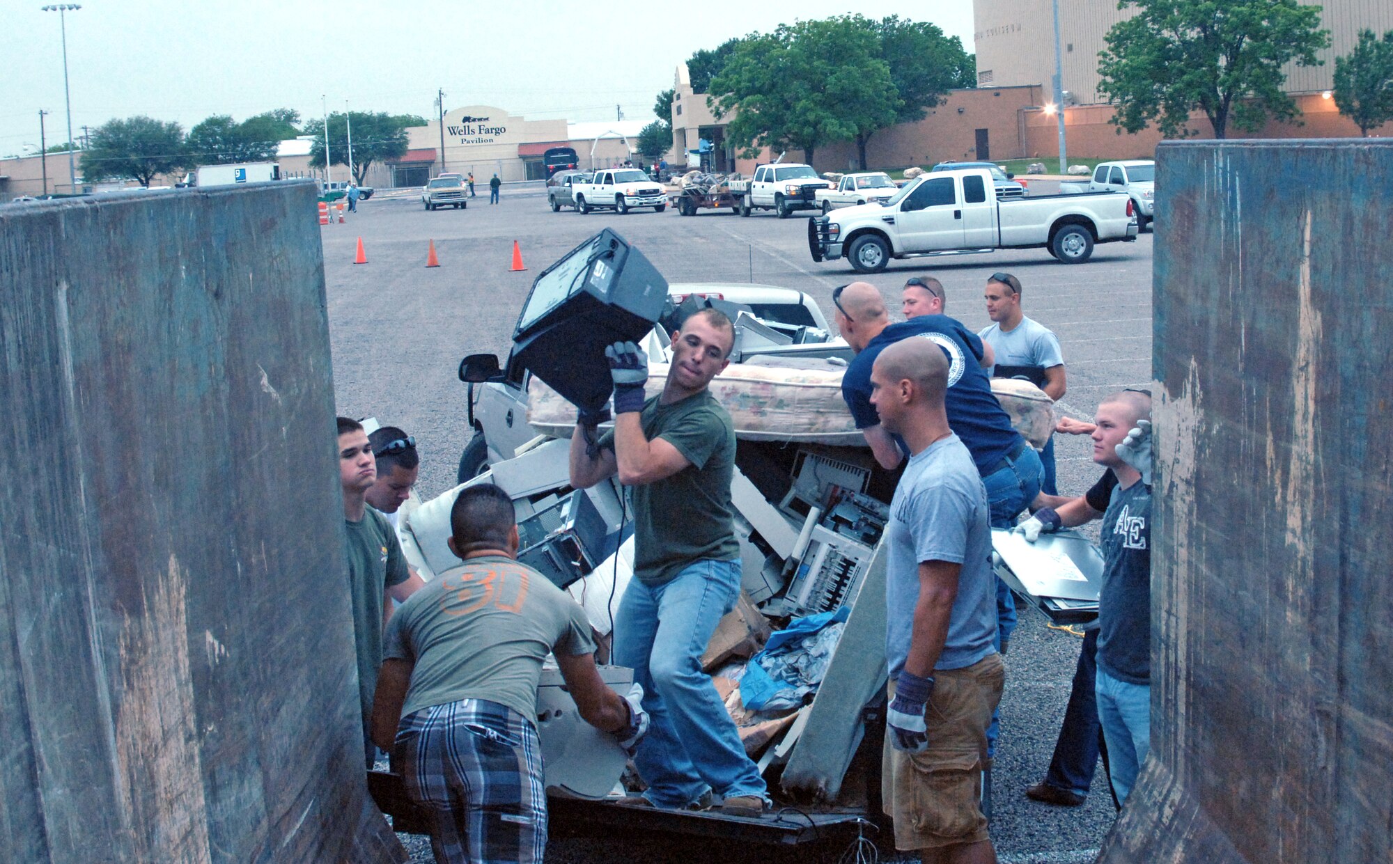 U.S. Marine Pfc. Brandon Foote, native of Chris Springs, Miss. assigned to Goodfellow Air Force Base, Texas, heaves a computer monitor into a rubbish container.  Almost 100 Airmen and Marines from Goodfellow lent a hand for a portion of the annual month-long Great American Cleanup May 2, the nation's largest community improvement program.   As part of the Keep San Angelo Beautiful program, Team Goodfellow members took part in the large trash drop and recycling event held at the San Angelo Coliseum, Texas.
(U.S. Air Force photo by Senior Master Sgt. Robert Martinez)