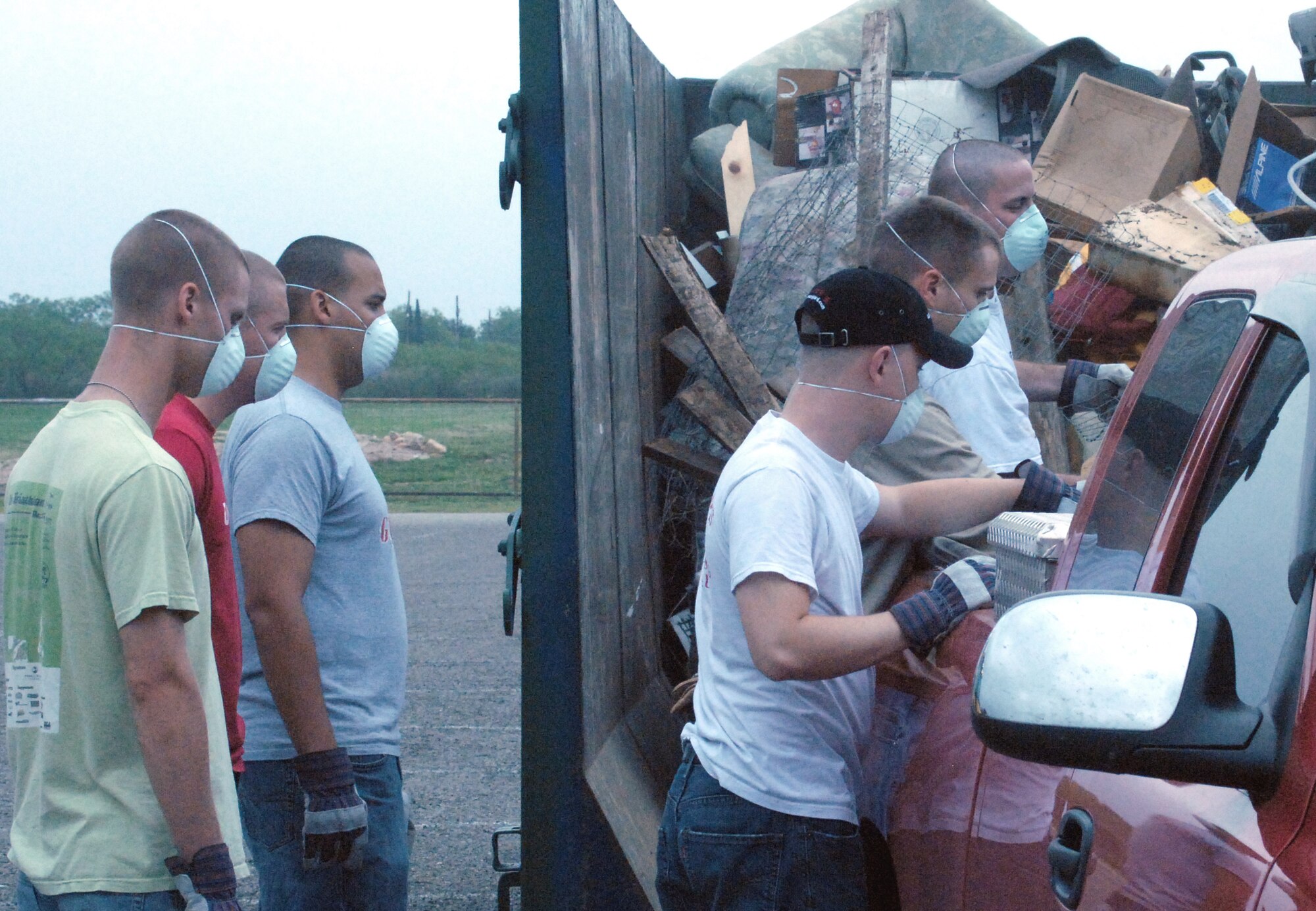 Marines from the Marine Corps Detachment, Goodfellow Air Force Base assist with rubbish drop off.  Almost 100 Airmen and Marines from Goodfellow lent a hand for a portion of the annual month-long Great American Cleanup, the nation's largest community improvement program, May 2.   As part of the Keep San Angelo Beautiful program, Team Goodfellow members took part in the large trash drop and recycling event held at the San Angelo Coliseum, Texas.
(U.S. Air Force photo by Senior Master Sgt. Robert Martinez
