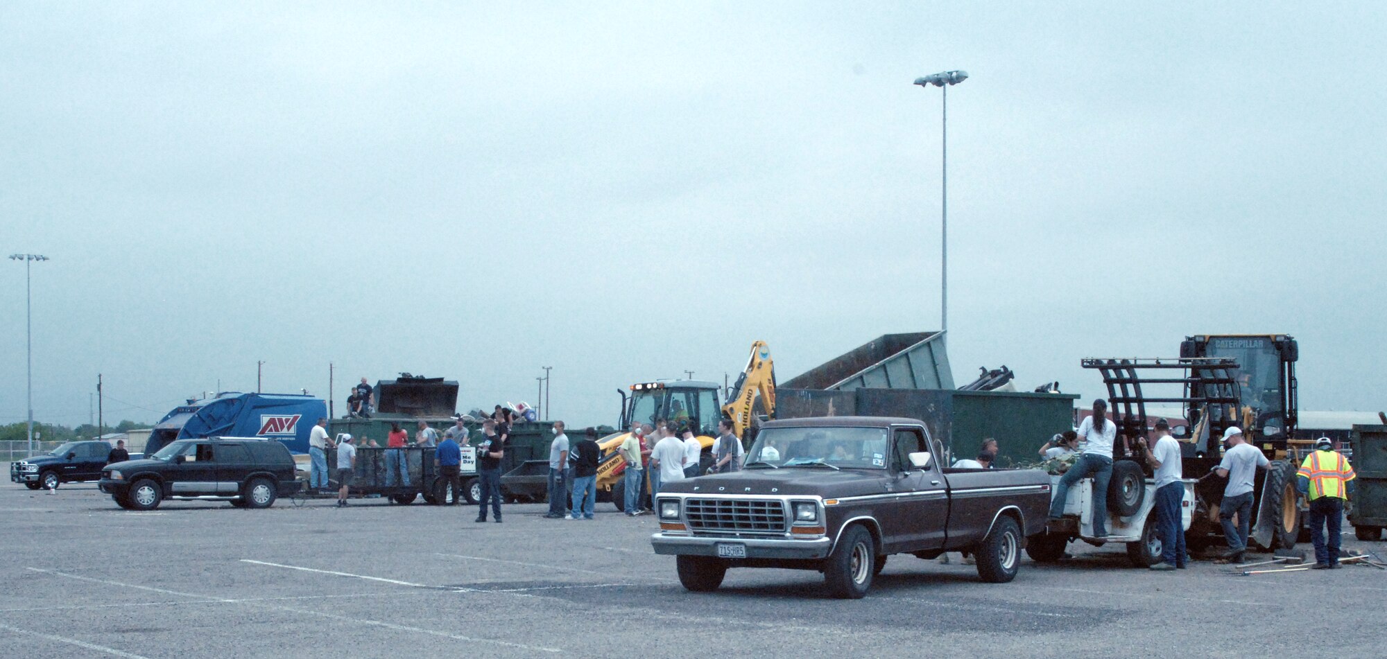 Vehicles back into drop off stations during  the large trash drop and recycling event held at the San Angelo Coliseum, Texas.  Almost 100 Airmen and Marines from Goodfellow Air Force Base lent a hand for a portion of the annual month-long Great American Cleanup, the nation's largest community improvement program, May 2.   As part of the Keep San Angelo Beautiful program, Team Goodfellow members took part in the all day event.
(U.S. Air Force photo by Senior Master Sgt. Robert Martinez)