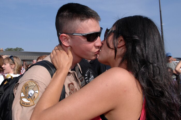 U.S. Air Force Senior Airman Kenneth Common and girlfriend, Stacy Romero, reunite at Charleston Air Force Base, S.C., May 3, 2009. More than 140 Airmen from the 16th Airlift Squadron returned from their 120-day deployment to the Middle East in support of Operations Enduring and Iraqi freedom and operations in the Horn of Africa. While deployed, the 16 AS airlifted more than 110 million pounds of cargo and 60,000 Airmen, Soldiers, Sailors, Marines and distinguished visitors throughout Southwest Asia. Airman Commons is a loadmaster for the 16 AS. (U.S. Air Force Photo by James M. Bowman)(Released)