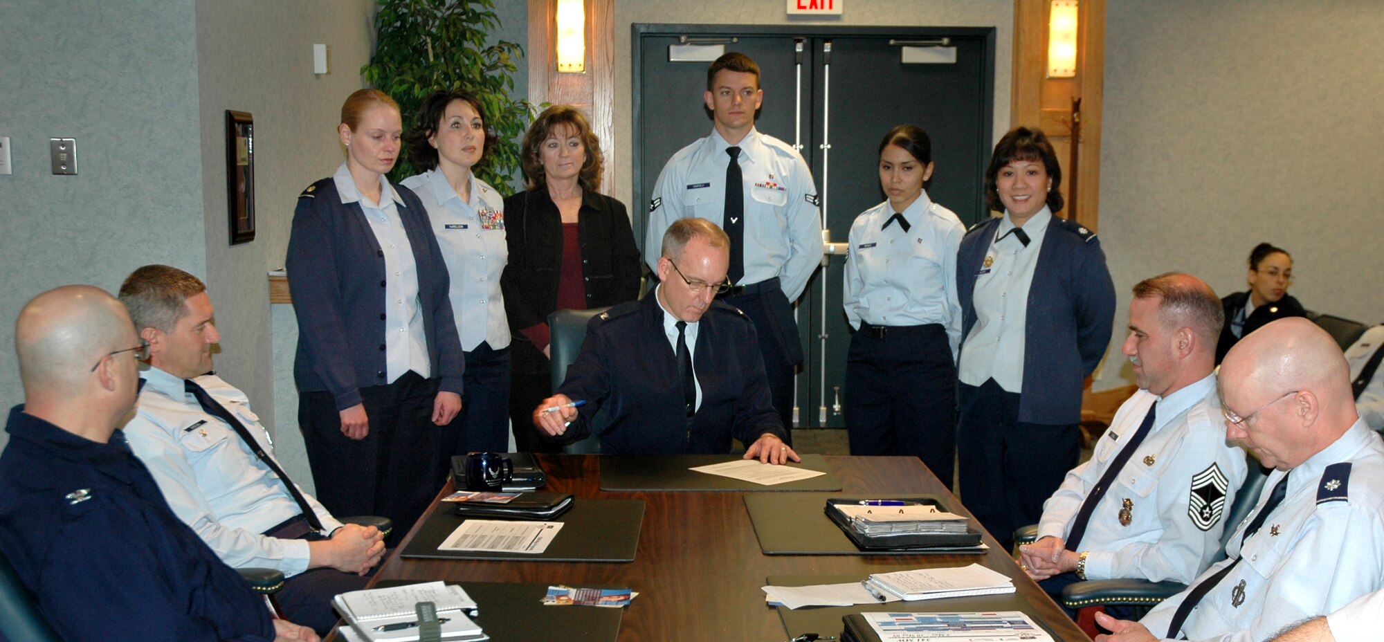 Col. Michael Fortney, 341st Missile Wing commander, signs the National Nurse/Technician Appreciation Week Proclamation May 4 in the Wing Conference Room. (U.S. Air Force photo/Senior Airman Dillon White)