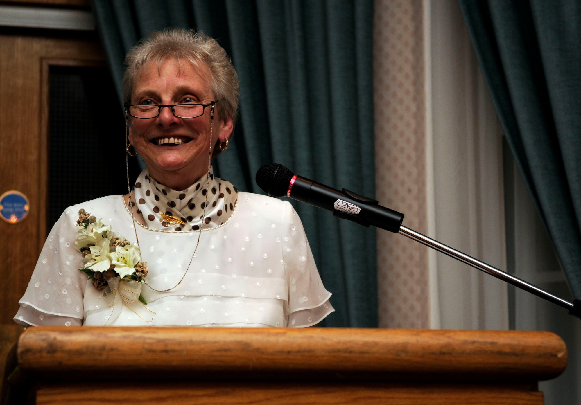 Faith Rutterford from the 100th Civil Engineer Squadron, makes a speach at a dinner honoring her 50 years of service as a commander's secretary at RAF Mildenhall, April 24.  Miss Rutterford has seen the 100th CES move through four buildings and seen her job move from old typewriters to computers.  (U.S. Air Force photo by Senior Airman Christopher L. Ingersoll)