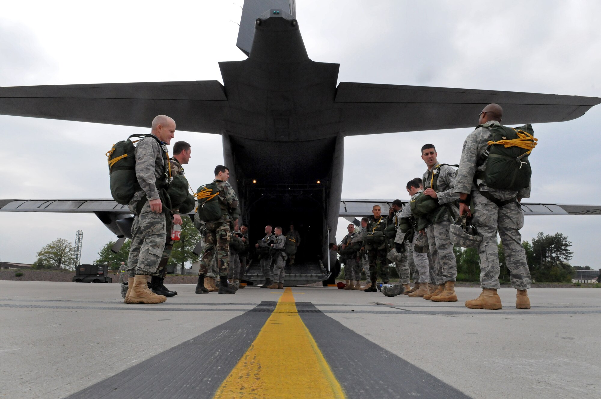 United States Air Force paratroopers wait to board the C-130E Hercules at Ramstein Air Base, Germany, April 30, 2009. The jump was conducted as part of the celebration for the Contingency Readiness Group's 10th anniversary. (U.S. Air Force photo by Airman 1st Class Grovert Fuentes-Contreras)